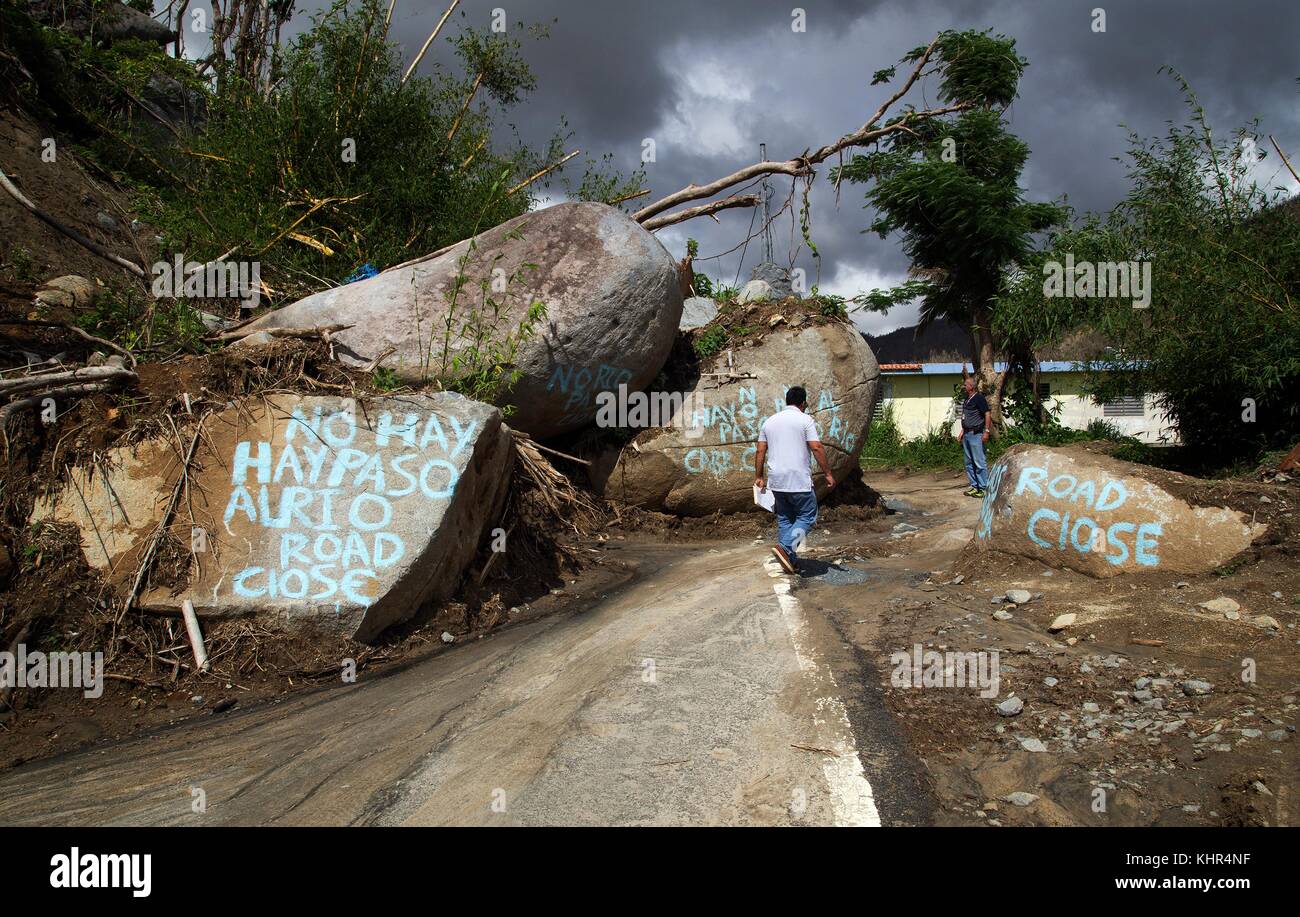 Large boulders that detached from the mountain during Hurricane Maria block a road November 12, 2017 in Naguabo, Puerto Rico.  (photo by Yuisa Rios via Planetpix) Stock Photo