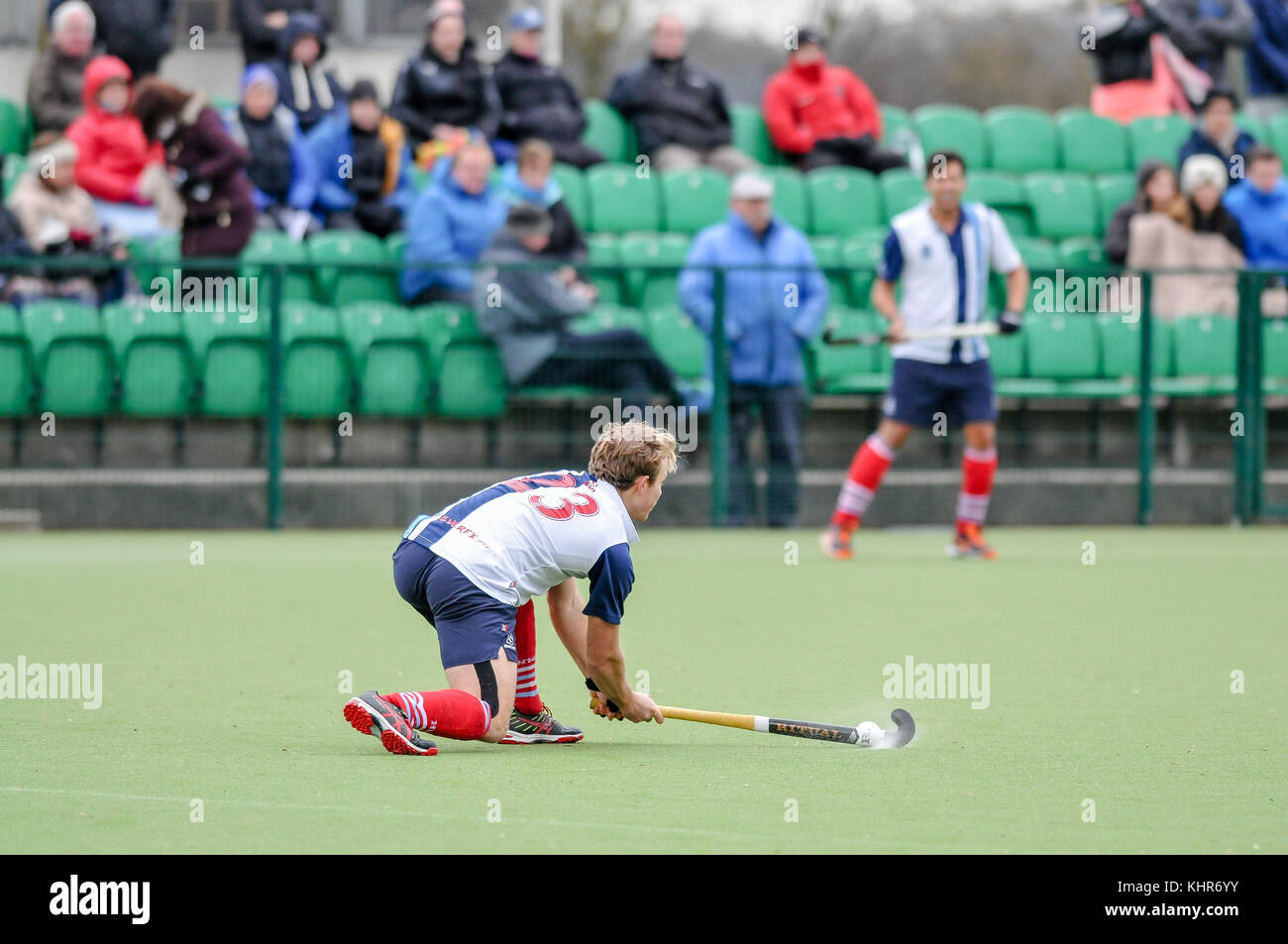 Mens field hockey, England, UK. Player hitting the ball Stock Photo Alamy