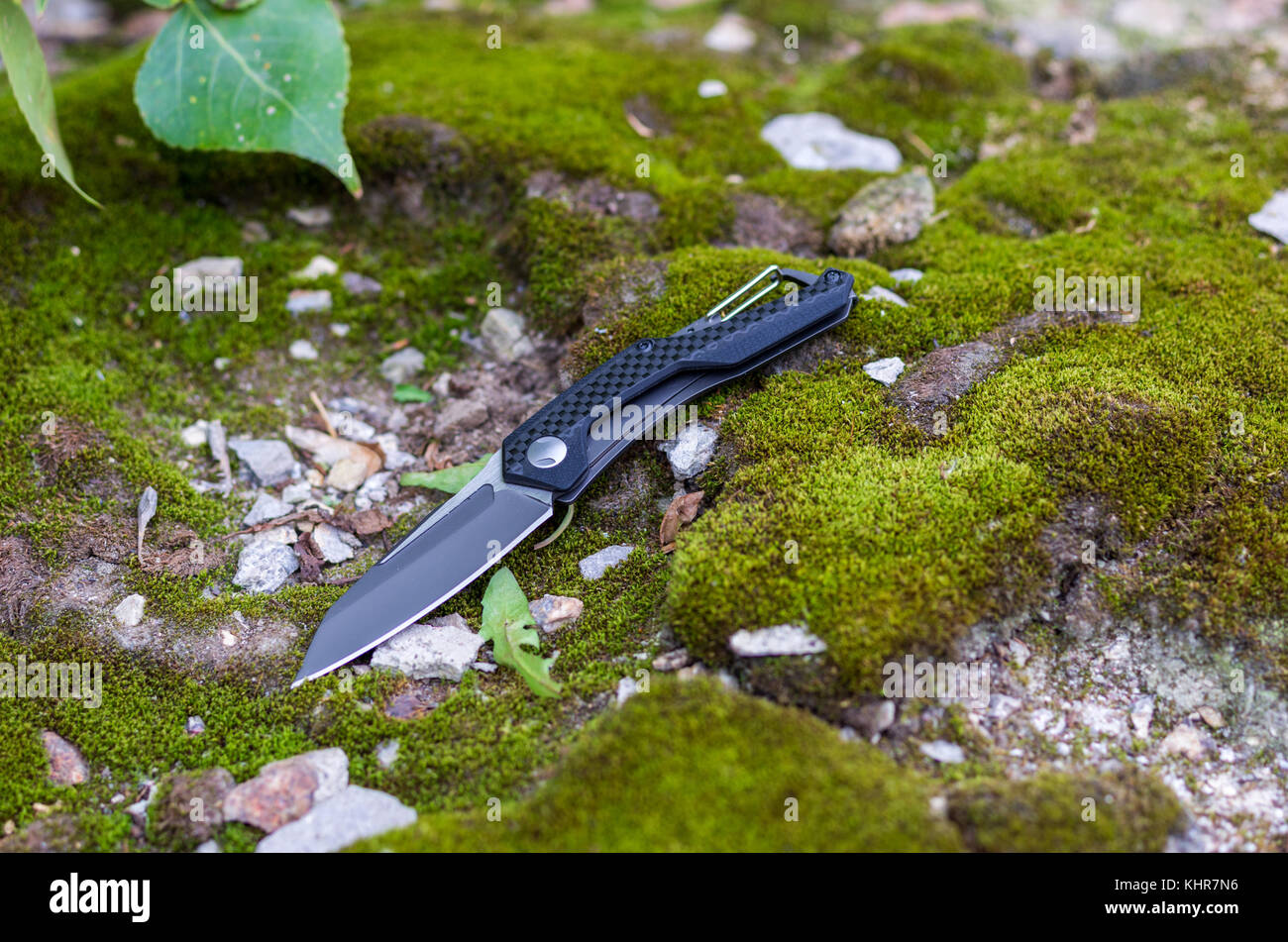 Pocket knife with a carbine. Knife for daily carrying. Photo on the