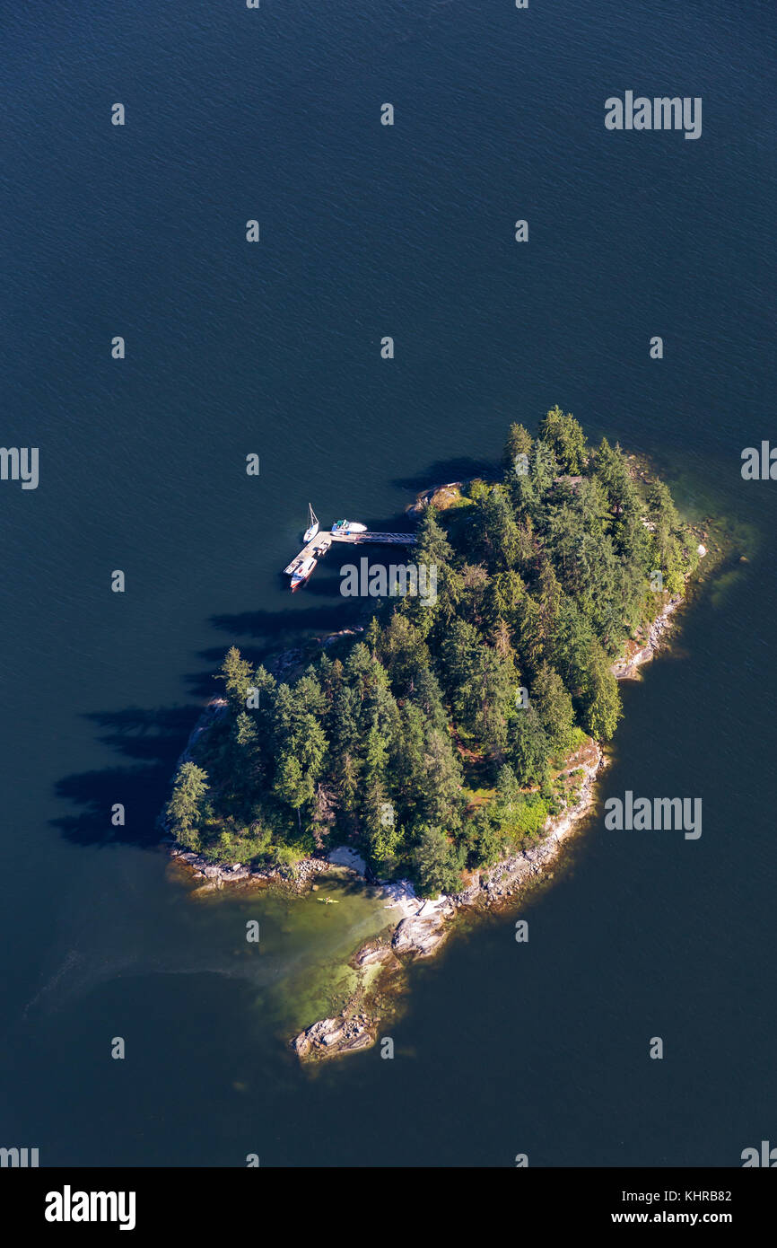 Aerial view of Boulder Island in Deep Cove, North Vancouver, British Columbia, Canada. Taken during a sunny summer day. Stock Photo