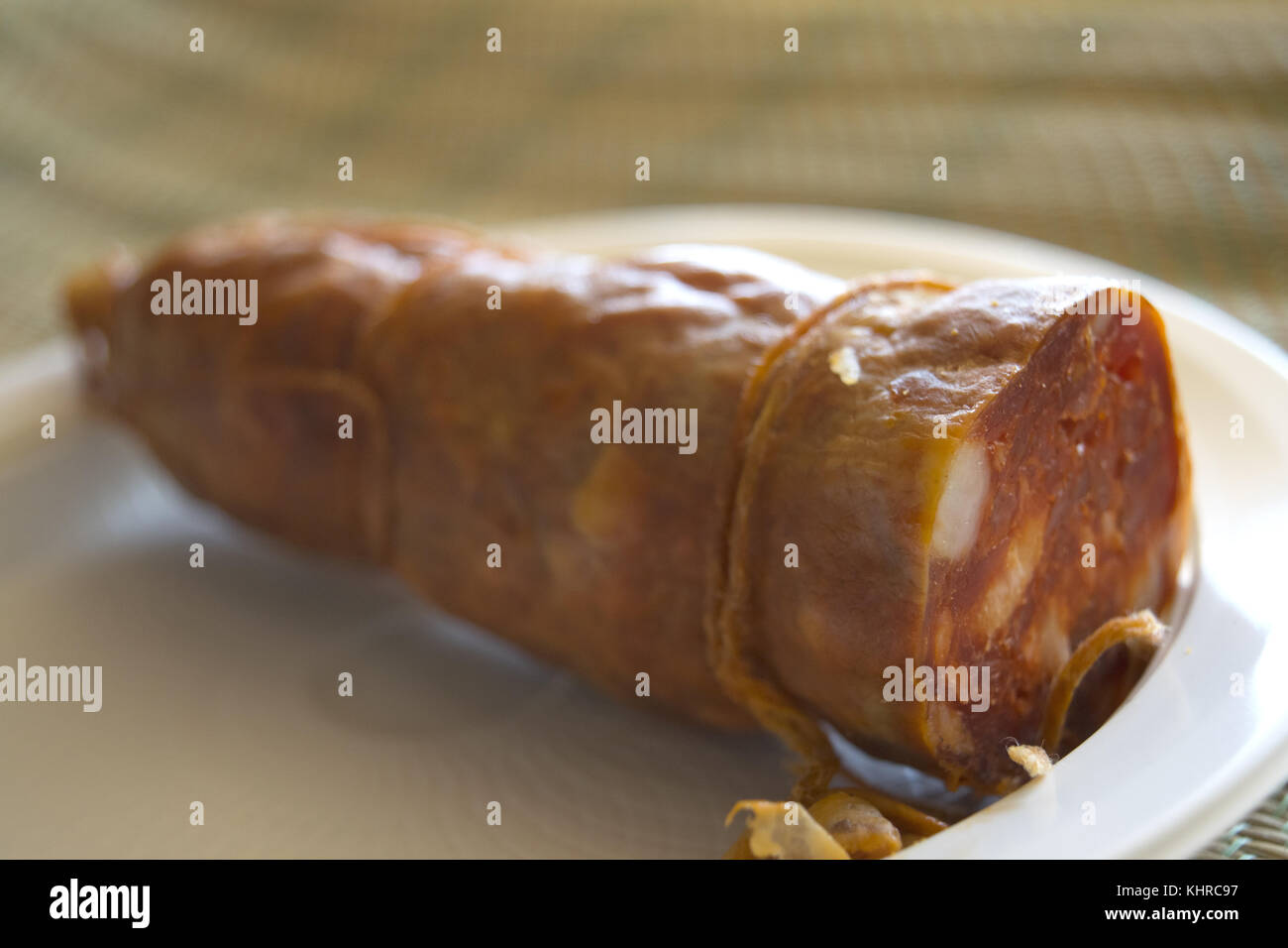 handmade calabrese soppressata on a white plastic dish Stock Photo Alamy