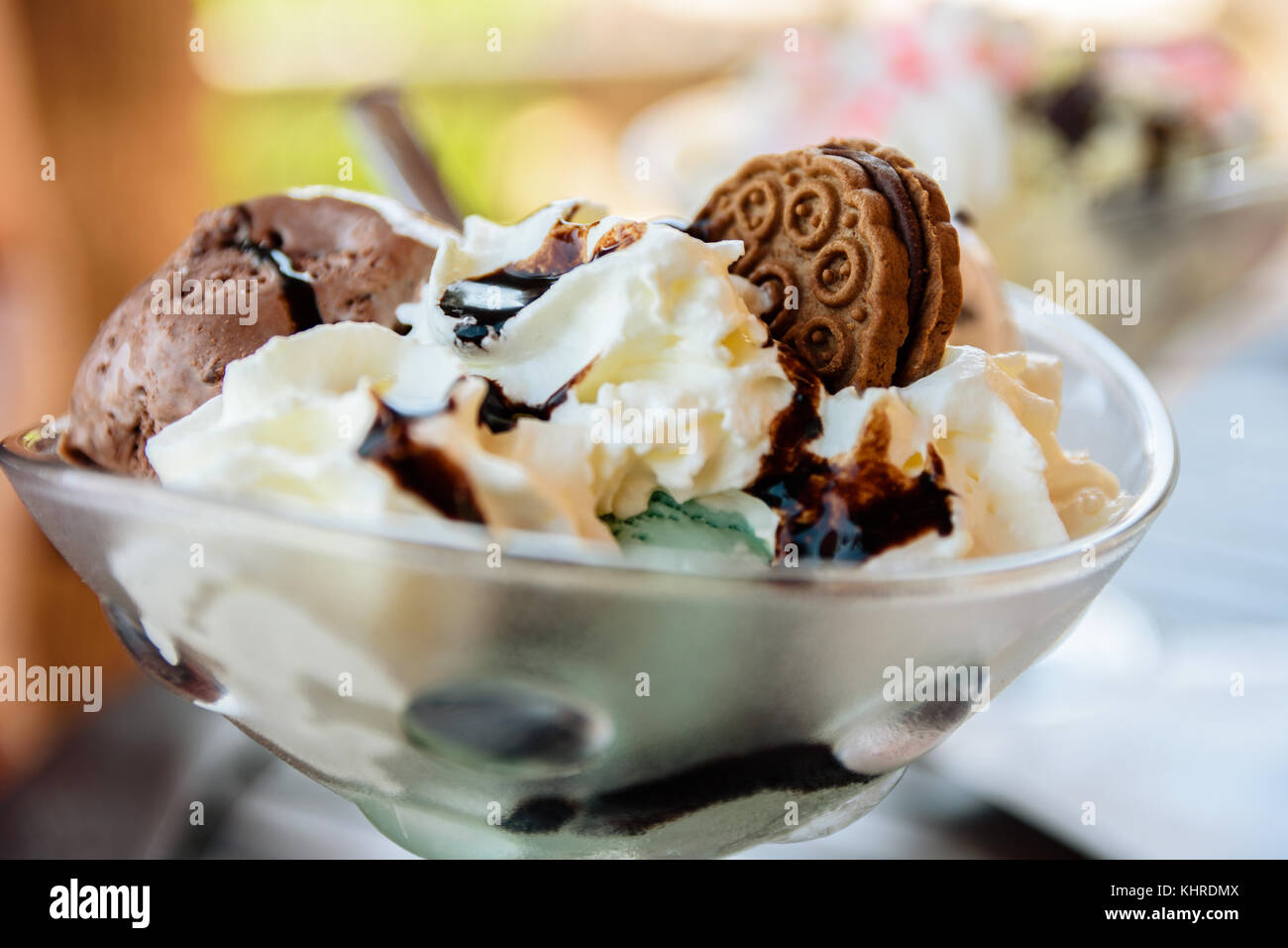 Mint And Chocolate Ice Cream Sundae With Sauce And Cookie In Glass Bowl Stock Photo