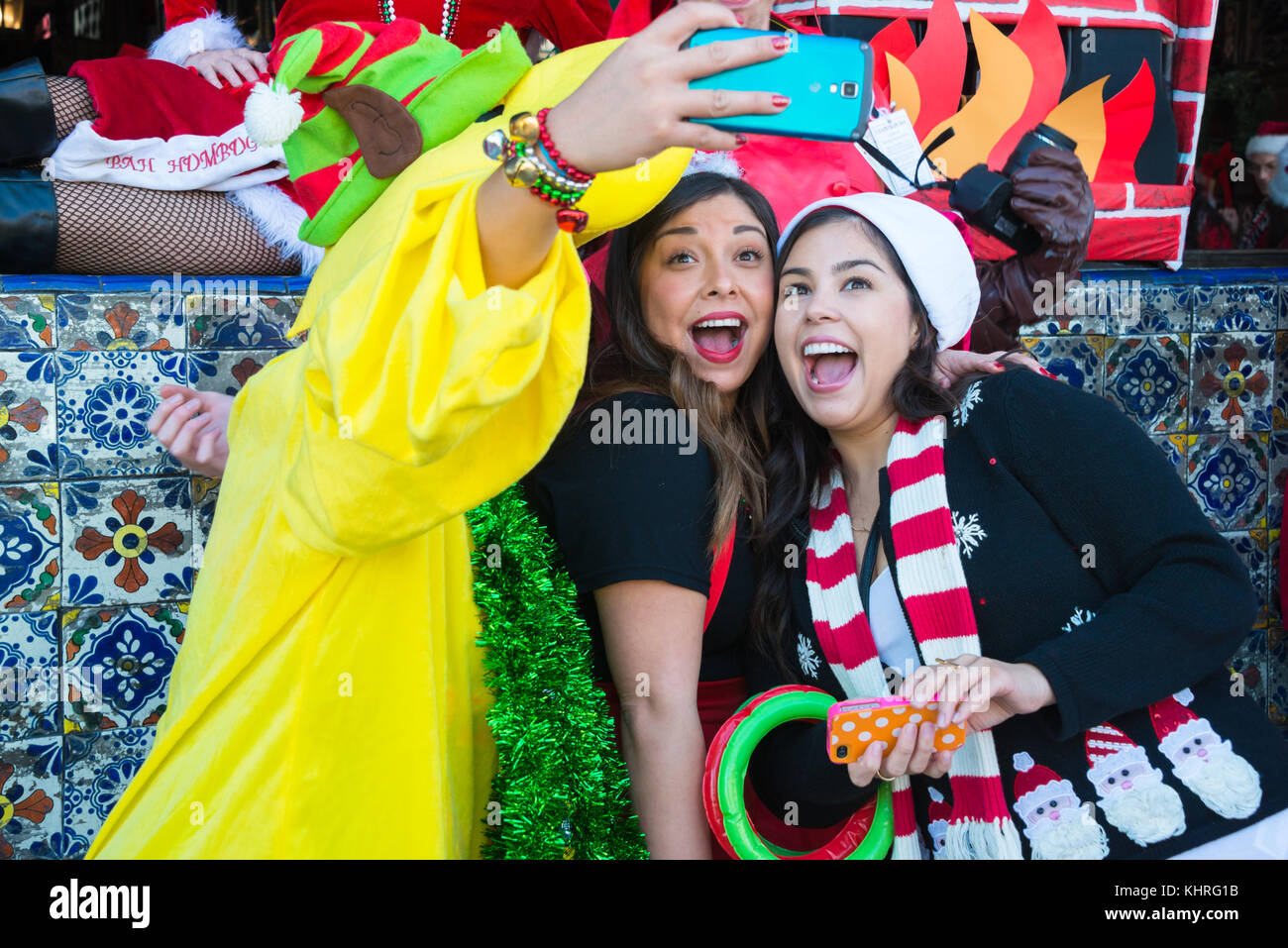 Millennial Santacon Revelers Taking a Selfie Stock Photo