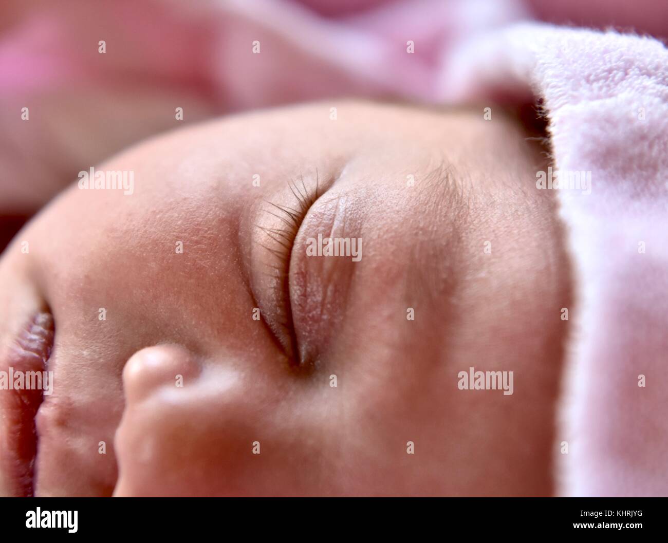 Baby girl with long eyelashes Stock Photo