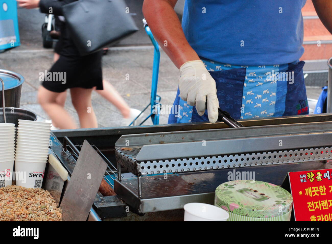 Korean street food stall at Busan Food Street. Unidentified woman