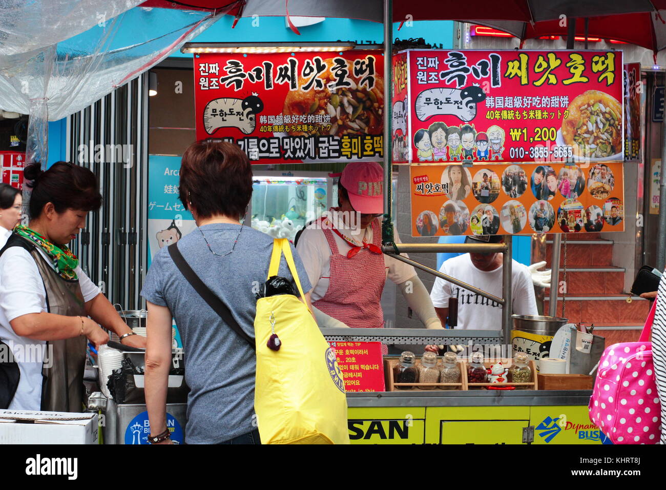 Korean street food stall at Busan Food Street. Unidentified woman ...