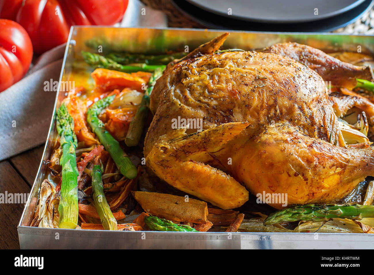 Homemade Roasted Stuffed Chicken Vegetables in Baking Form Yams Carrots Asparagus Onions Herbs Rosemary Thyme Golden Crust Festive Dinner Dish Christm Stock Photo