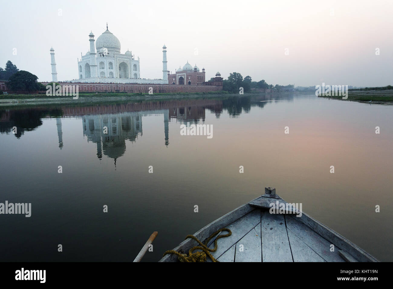 Reflection of Taj Mahal on Yamuna river at twilight from an old traditional fishermans boat, UNESCO Site,  Agra, Uttar Pradesh state, India, Asia. Stock Photo
