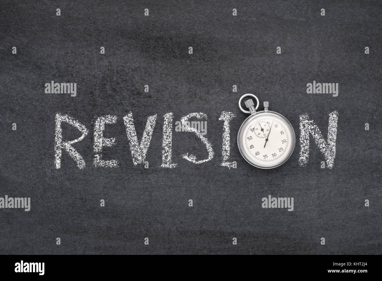 revision word handwritten on chalkboard with vintage precise stopwatch used instead of O Stock Photo
