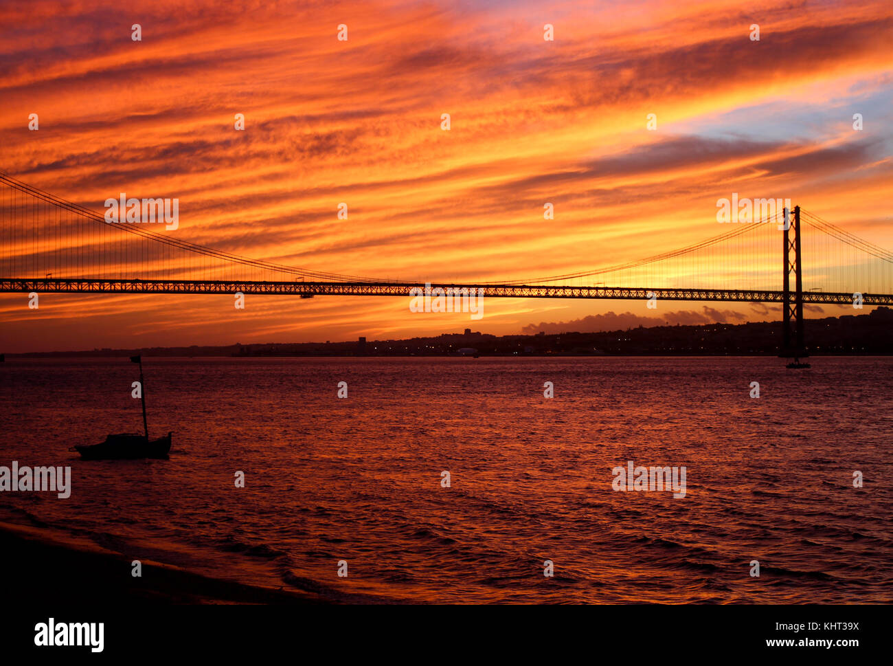 A blazing red sunset over the Tagus River. Lisbon, Portugal. Stock Photo