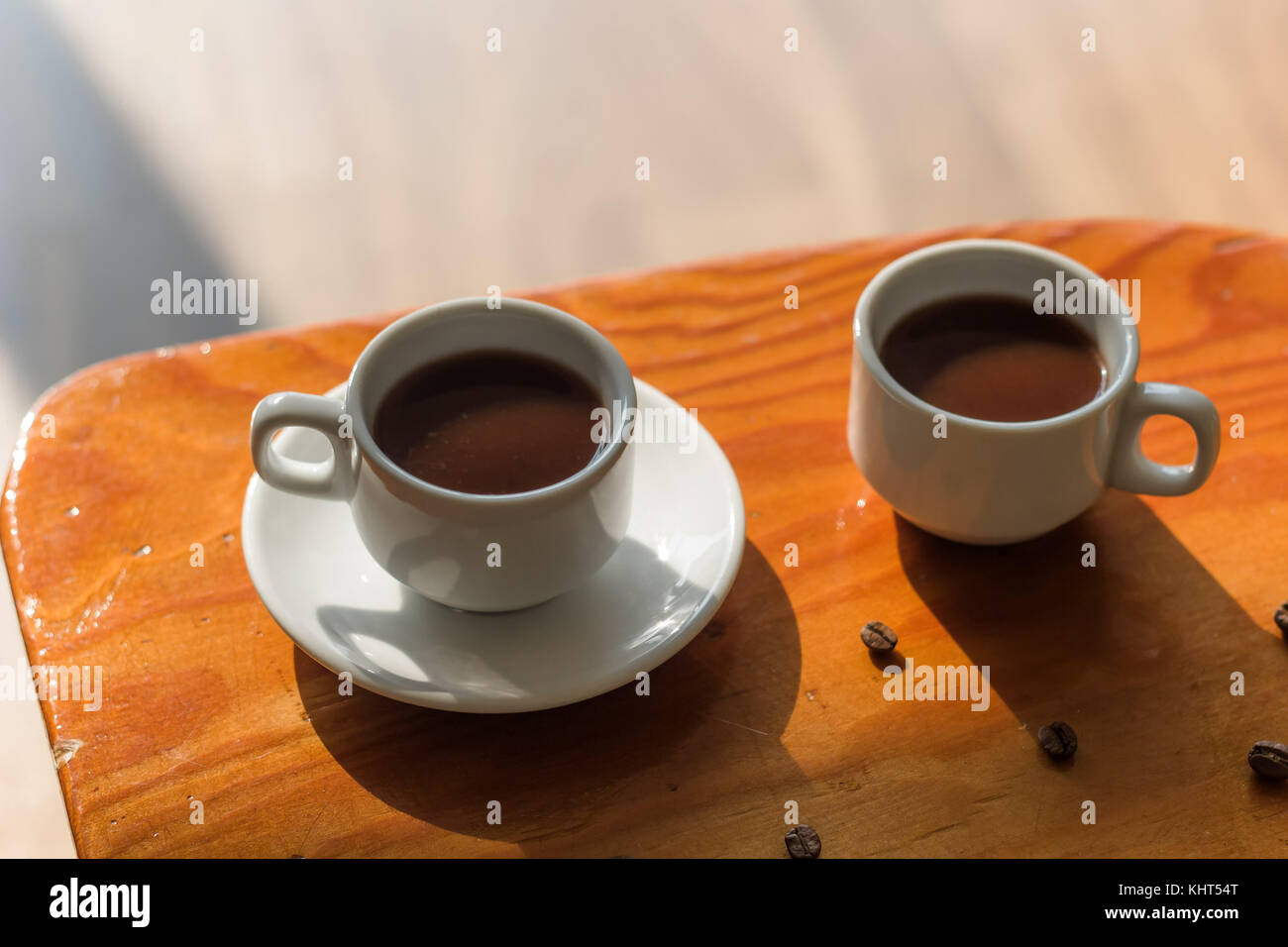 two white cups of black coffee on the table Stock Photo