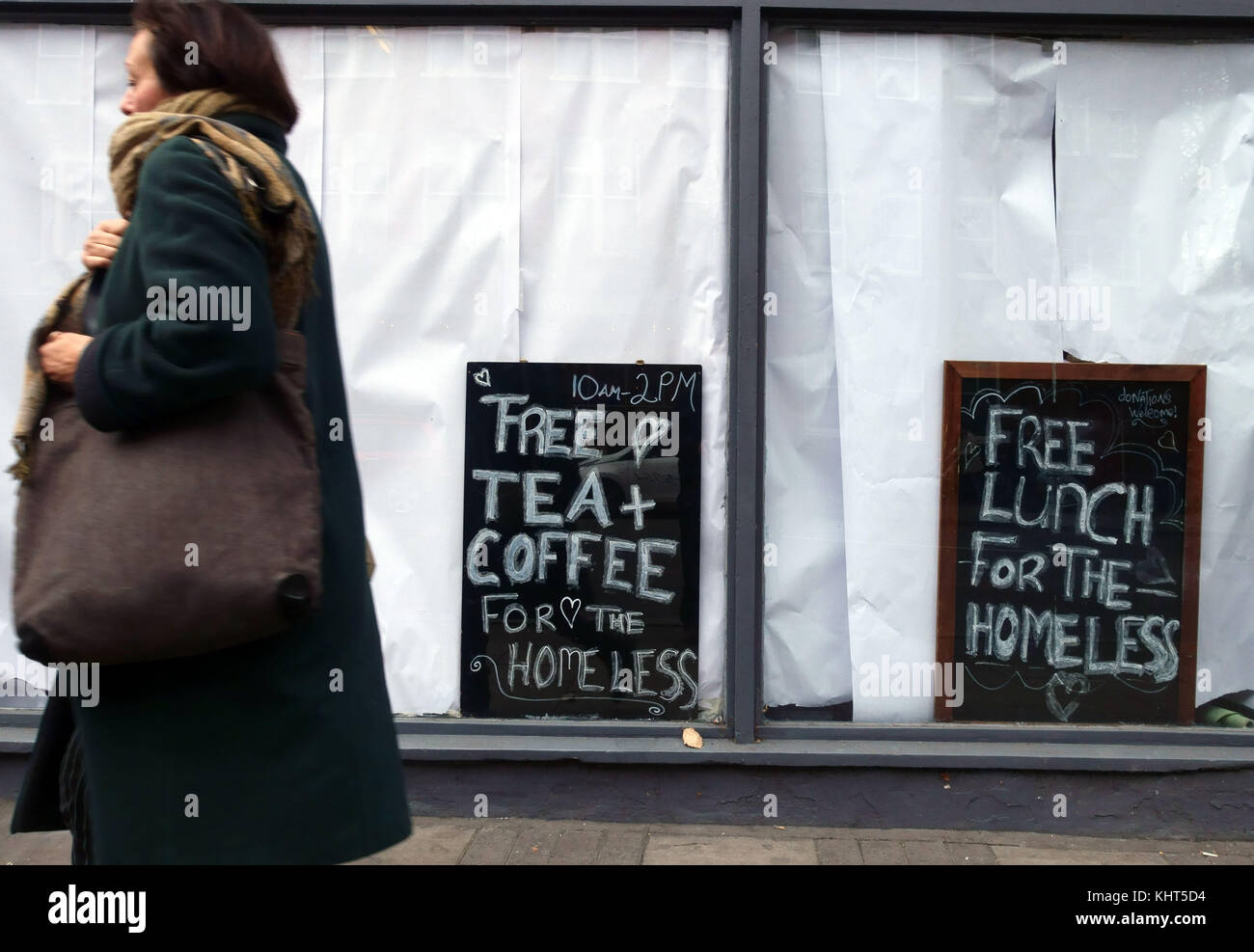 Free lunch and drinks offered to homeless people by squatters occupying a closed restaurant in Islington, London Stock Photo