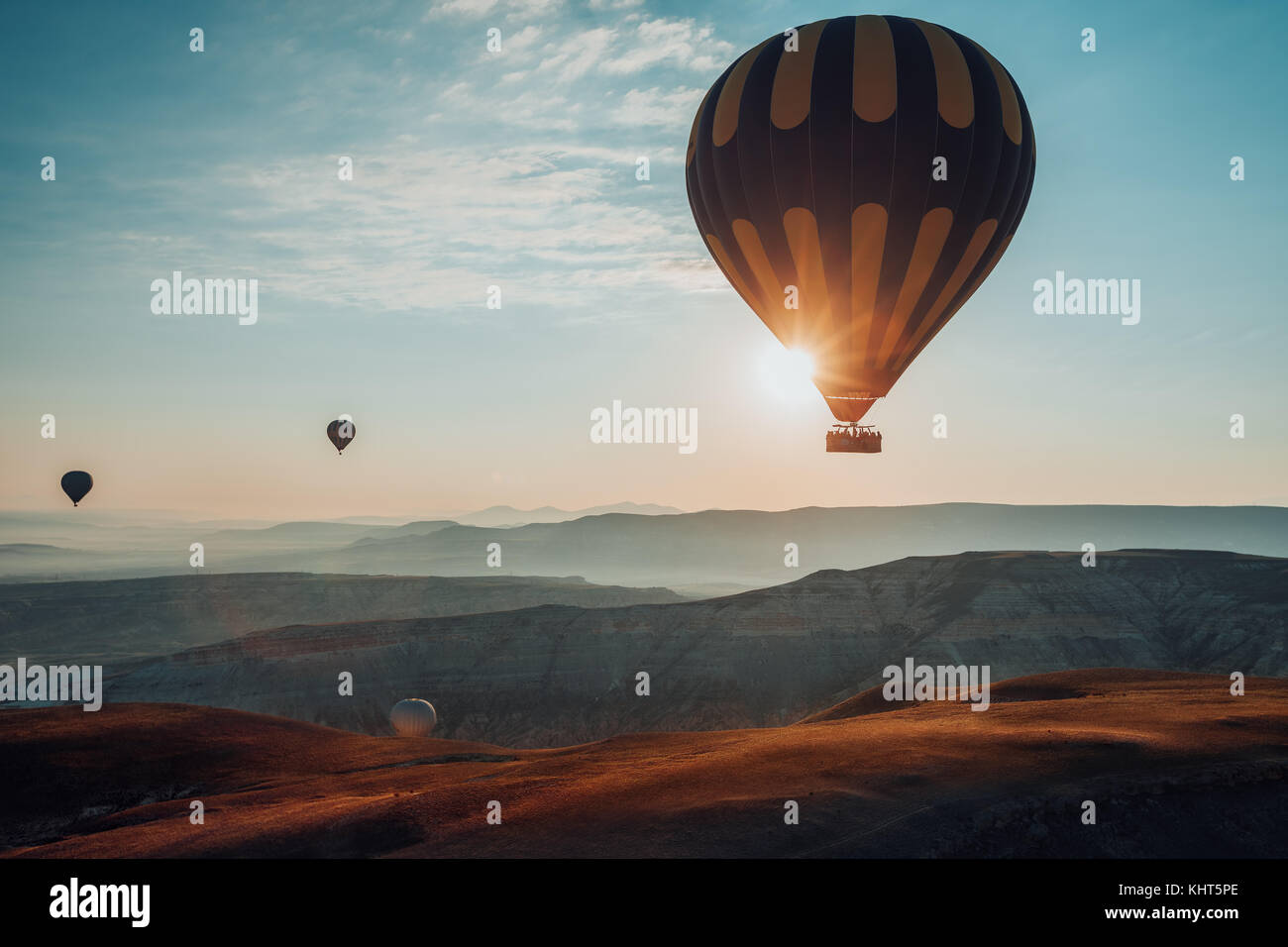 Hot air balloons flying over the valley at Cappadocia, Turkey Stock ...