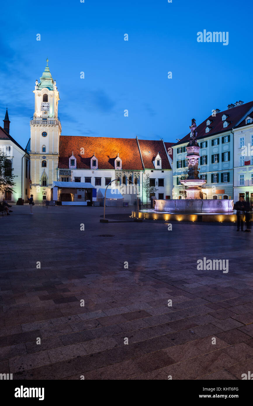 Bratislava Old Town Main Square at night in Slovakia with Roland Fountain and Old Town Hall building. Stock Photo