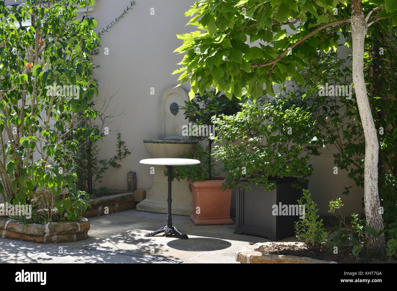 Garden in Italian or mediterranean style with lush plants Stock Photo