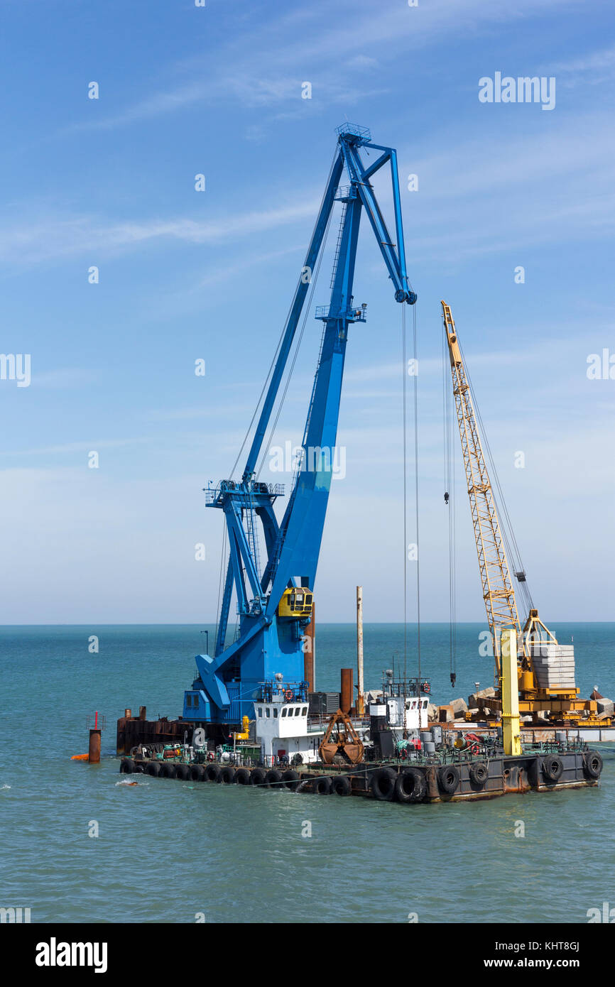crane barge doing marine heavy lift installation works in the gulf or