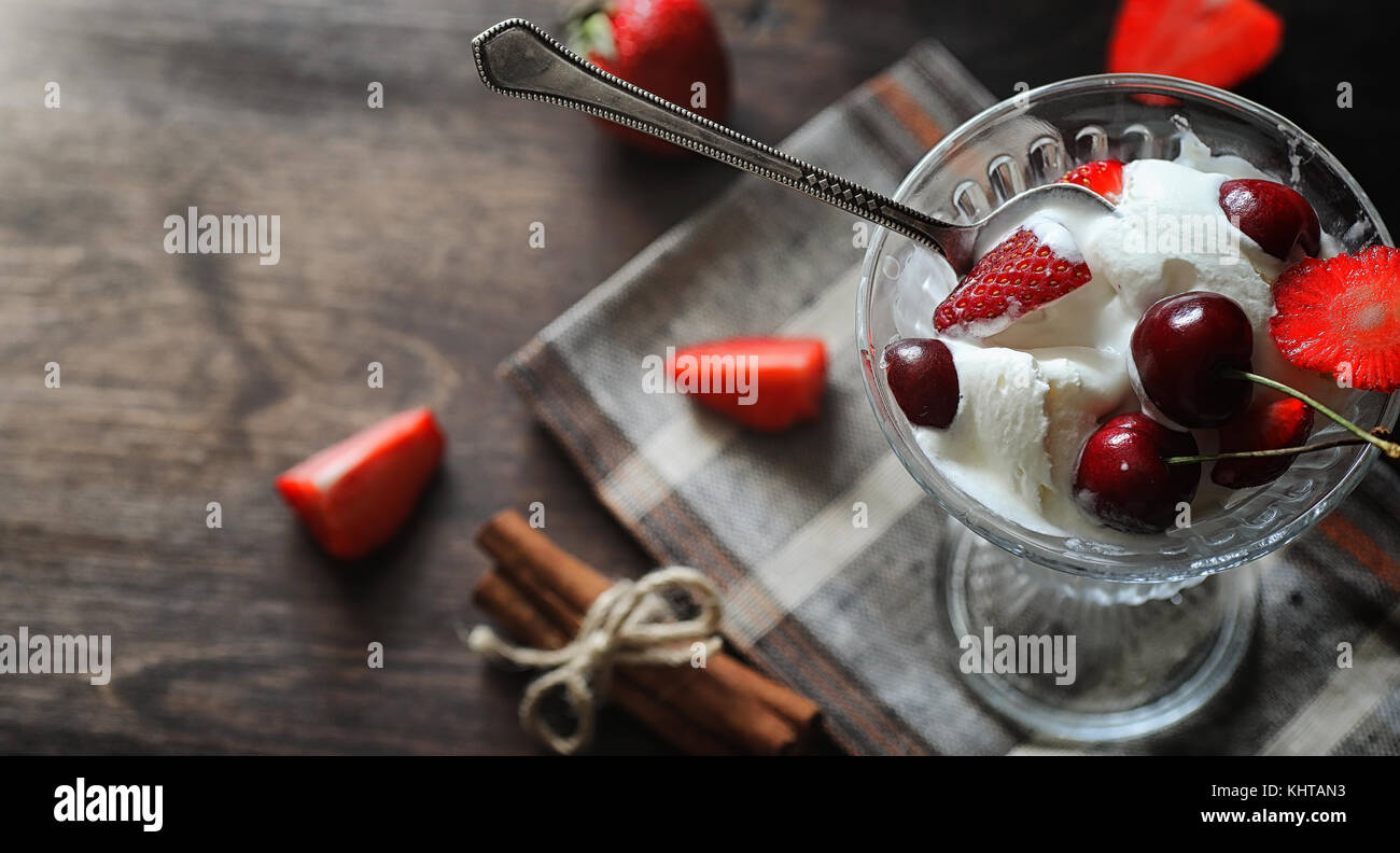 Fresh yogurt with berries. Ice cream in a bowl with fresh and ju Stock Photo