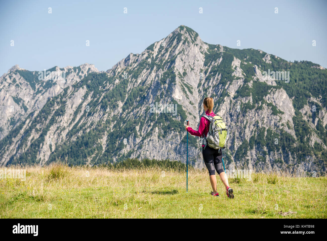 Young woman hiking in the mountains Stock Photo - Alamy