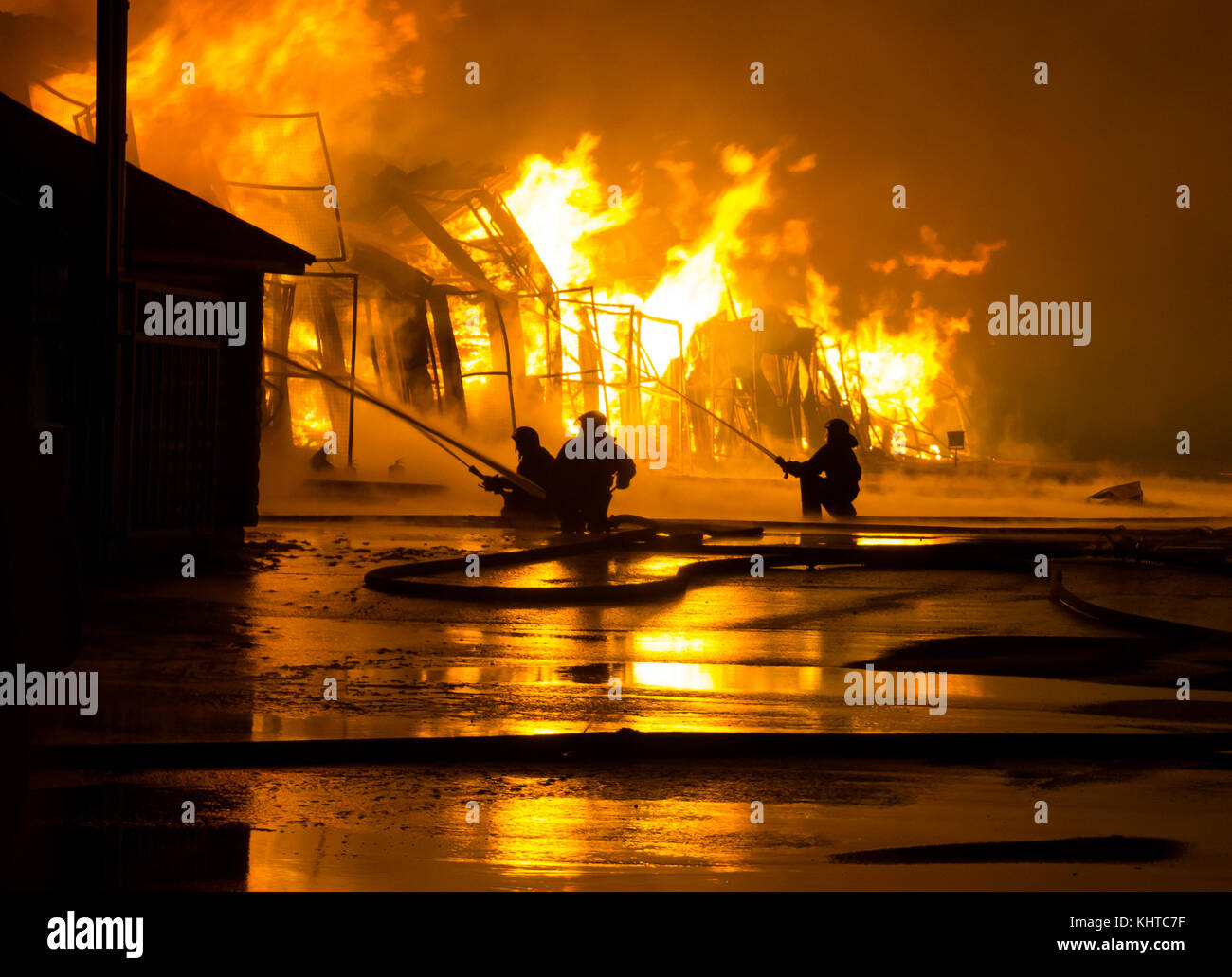 Firemen at work on fire Stock Photo