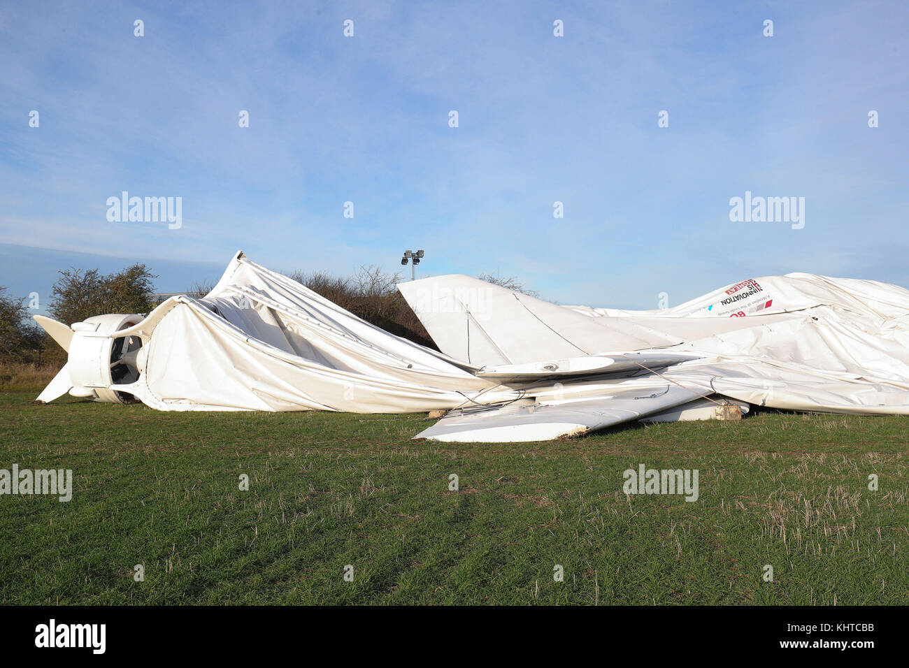 Airlander 10, the world's largest aircraft, lies on the ground at Cardington airfield in Bedfordshire, after the aircraft came loose from its moorings causing its hull to rip and deflate. Stock Photo