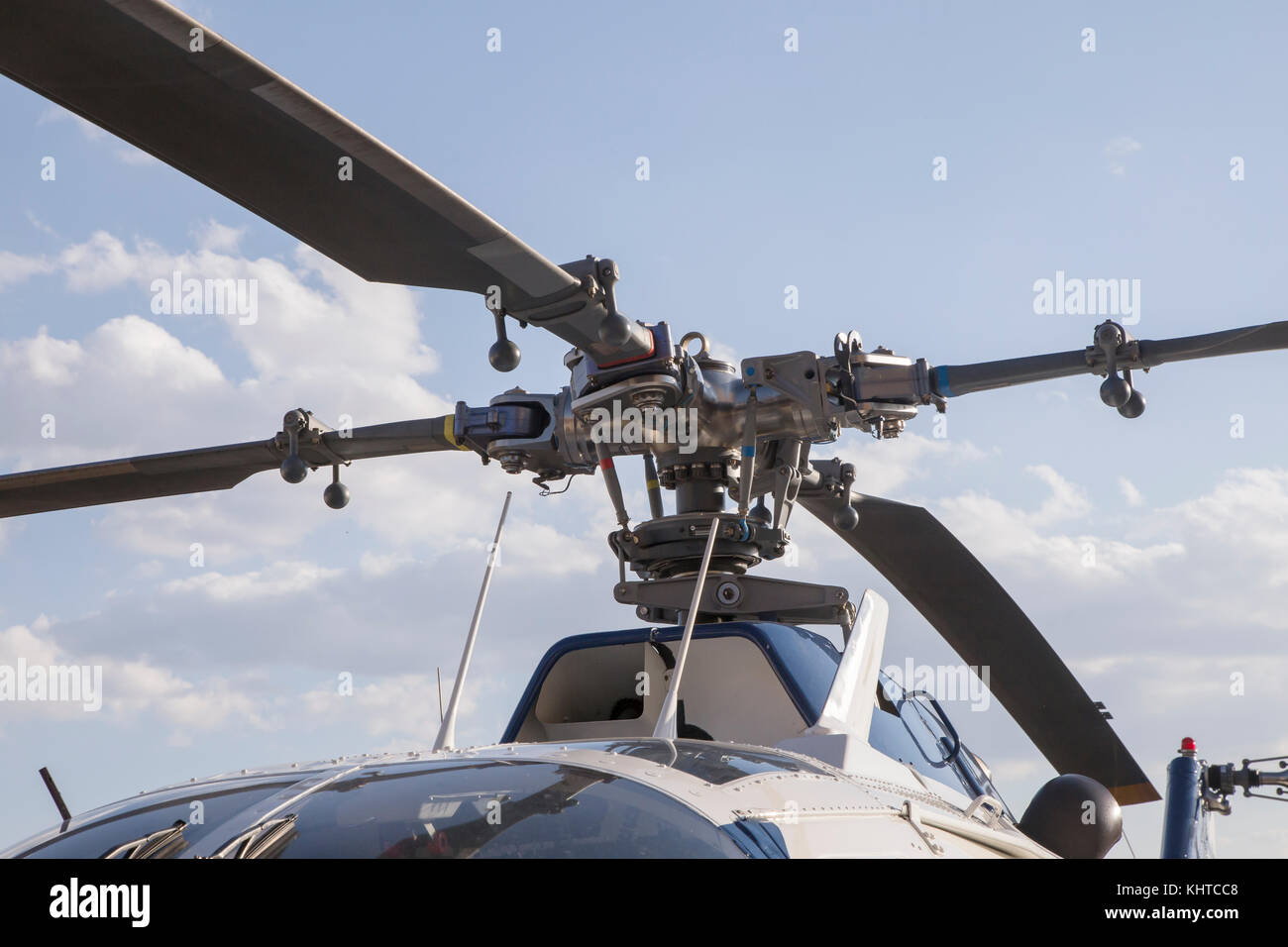 blades of a helicopter standing on land on a helipad Stock Photo Alamy