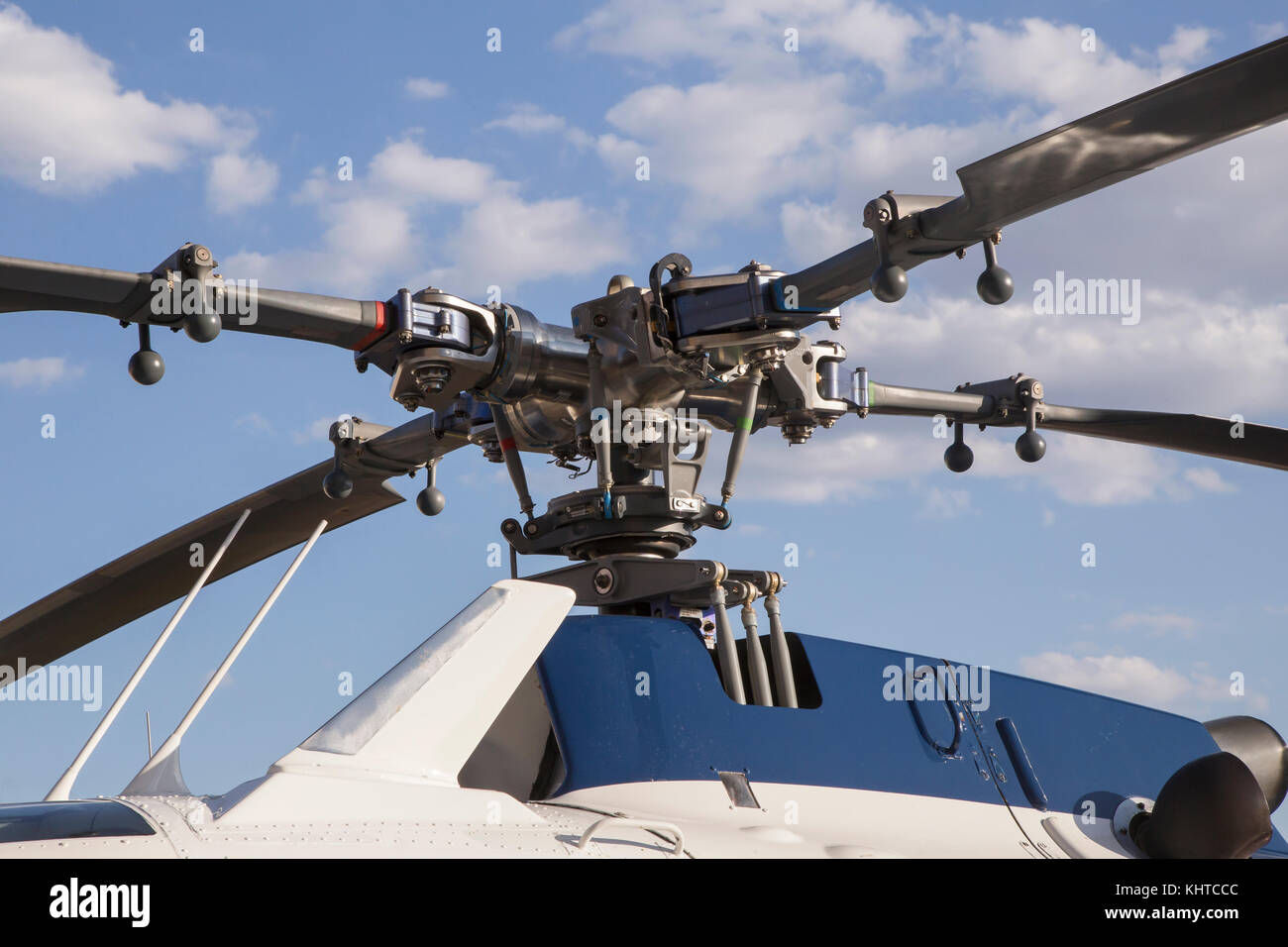 blades of a helicopter standing on land on a helipad Stock Photo Alamy