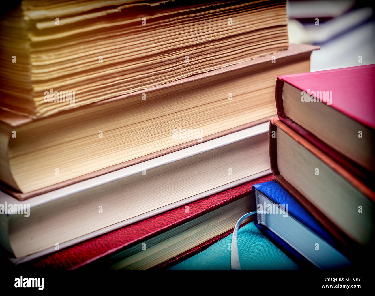 Several old books with pages worn stacked, conceptual image Stock Photo ...