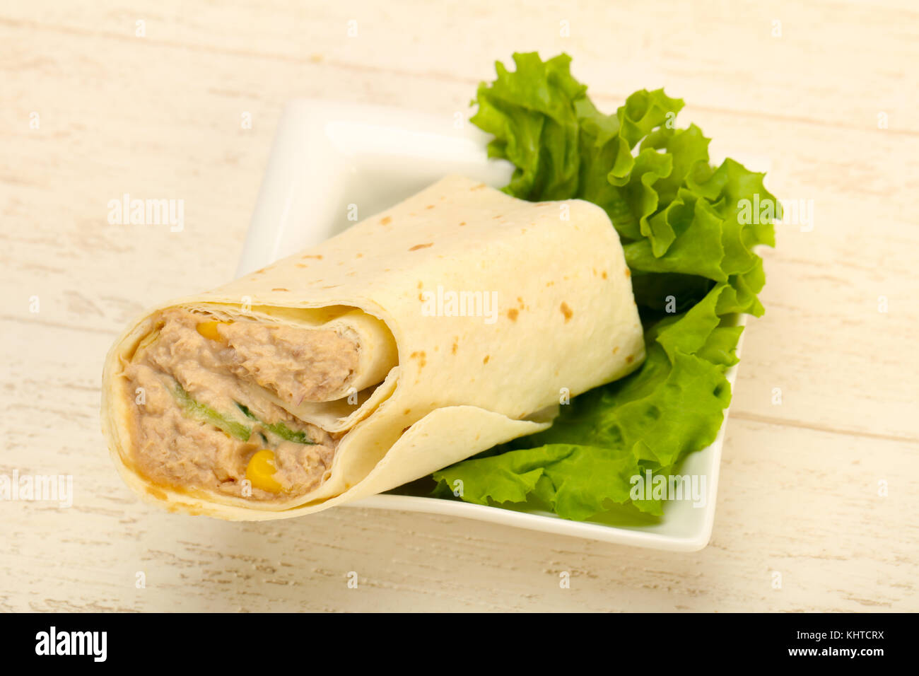 Tuna bread roll with salad leaves Stock Photo - Alamy