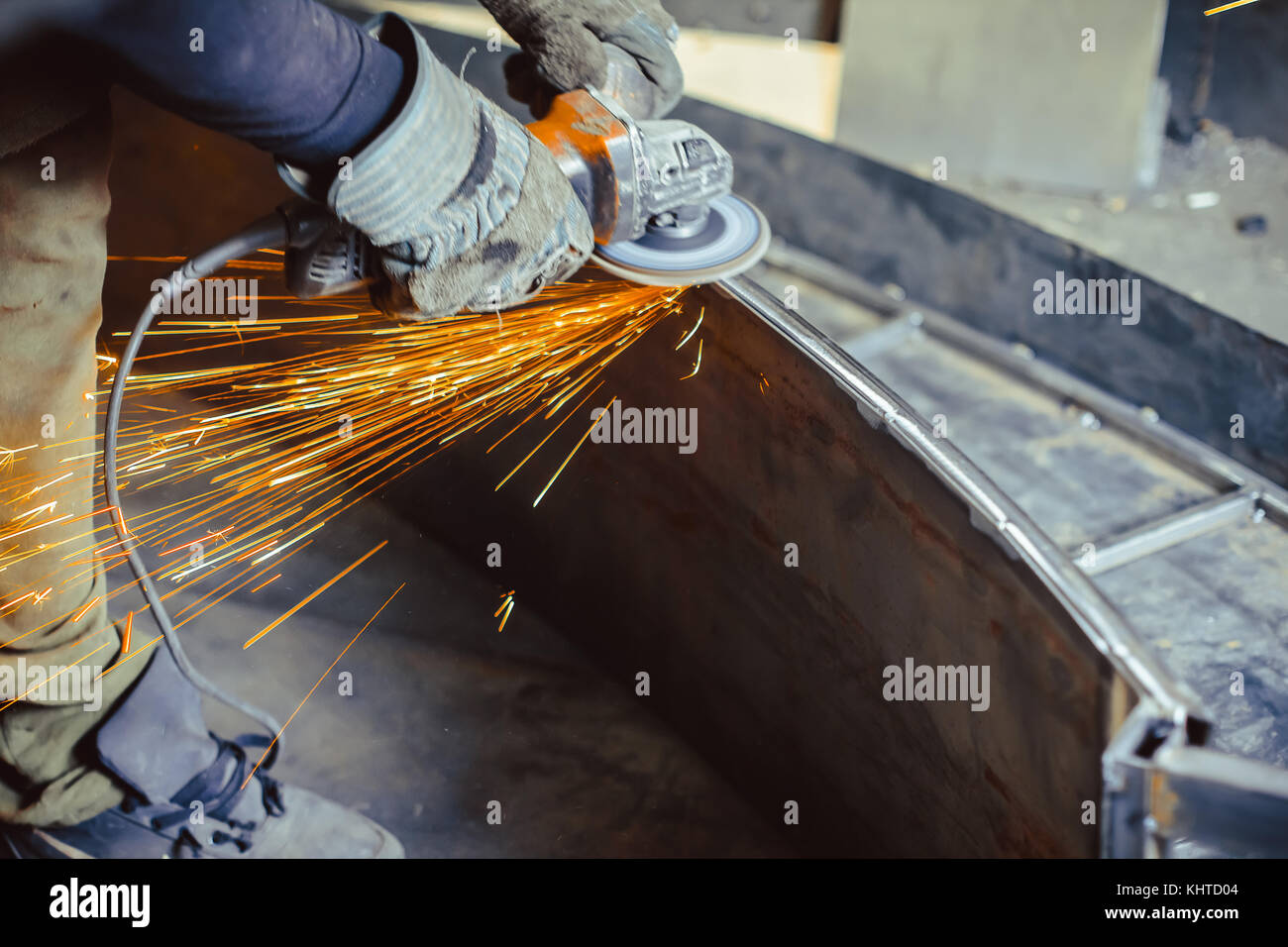 worker sawing metal with a saw, sparks fly Stock Photo Alamy