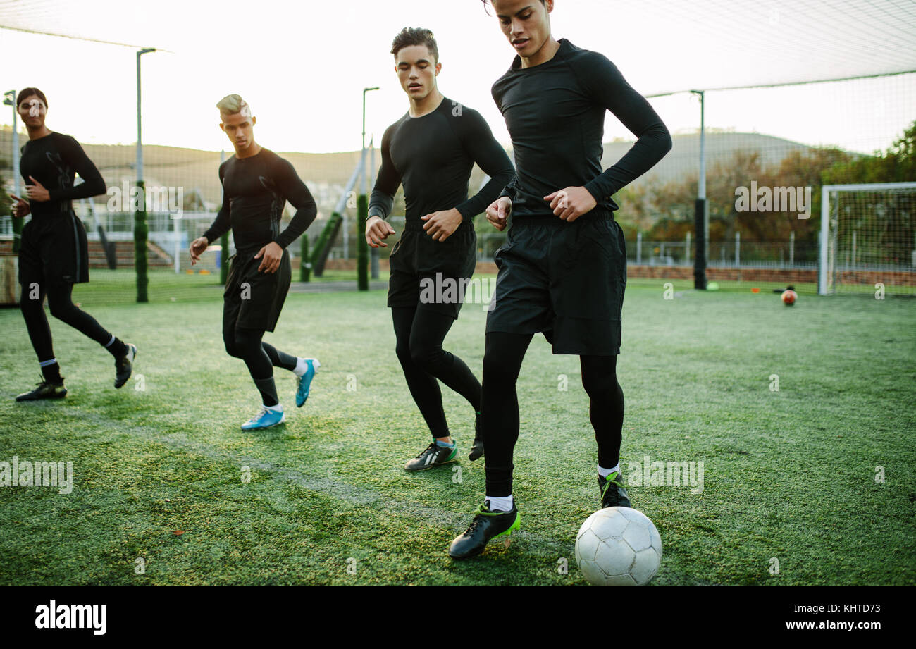 Football players training in soccer field. Five a side soccer team