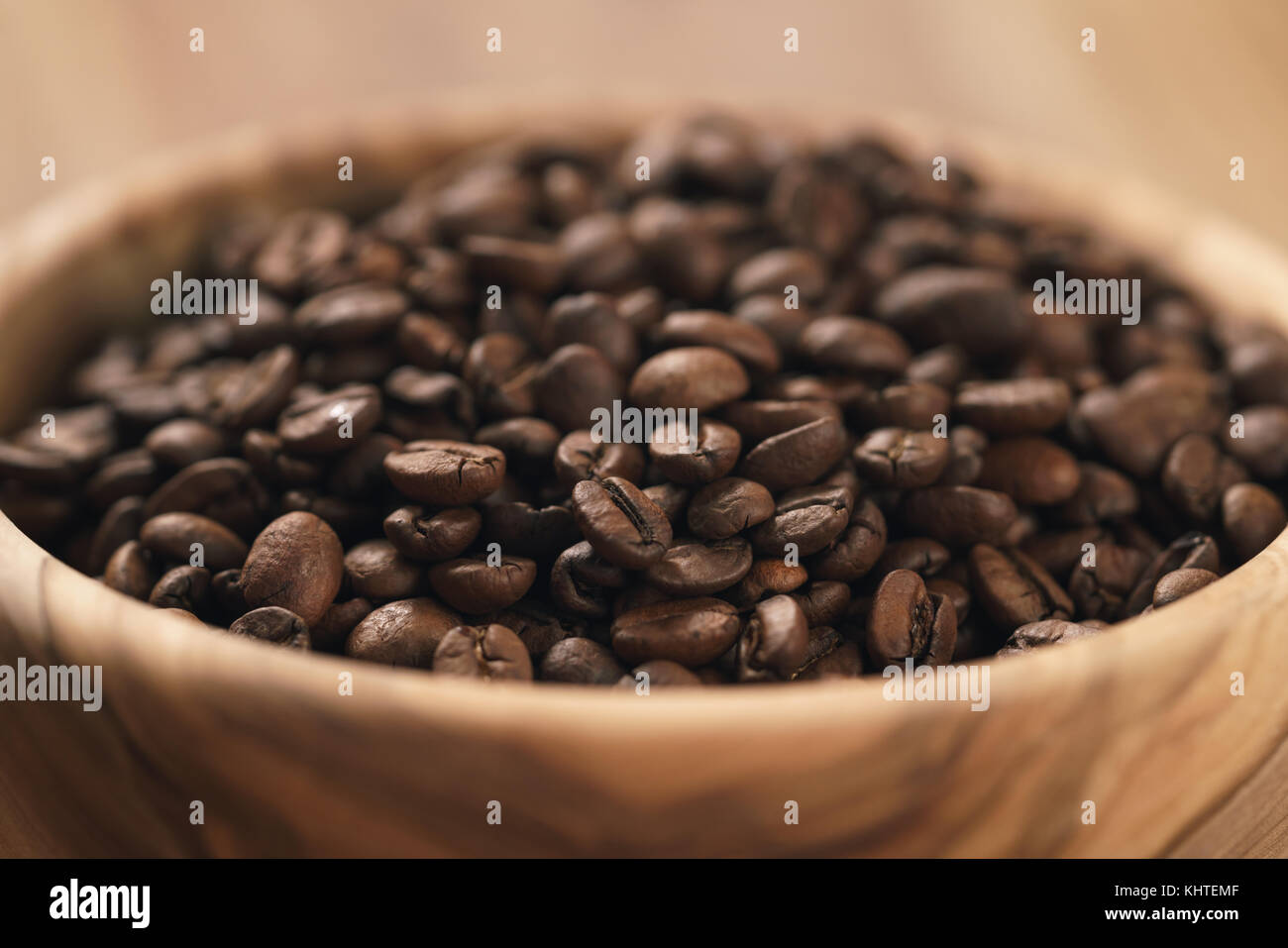 roasted coffee beans in wood bowl on table Stock Photo - Alamy