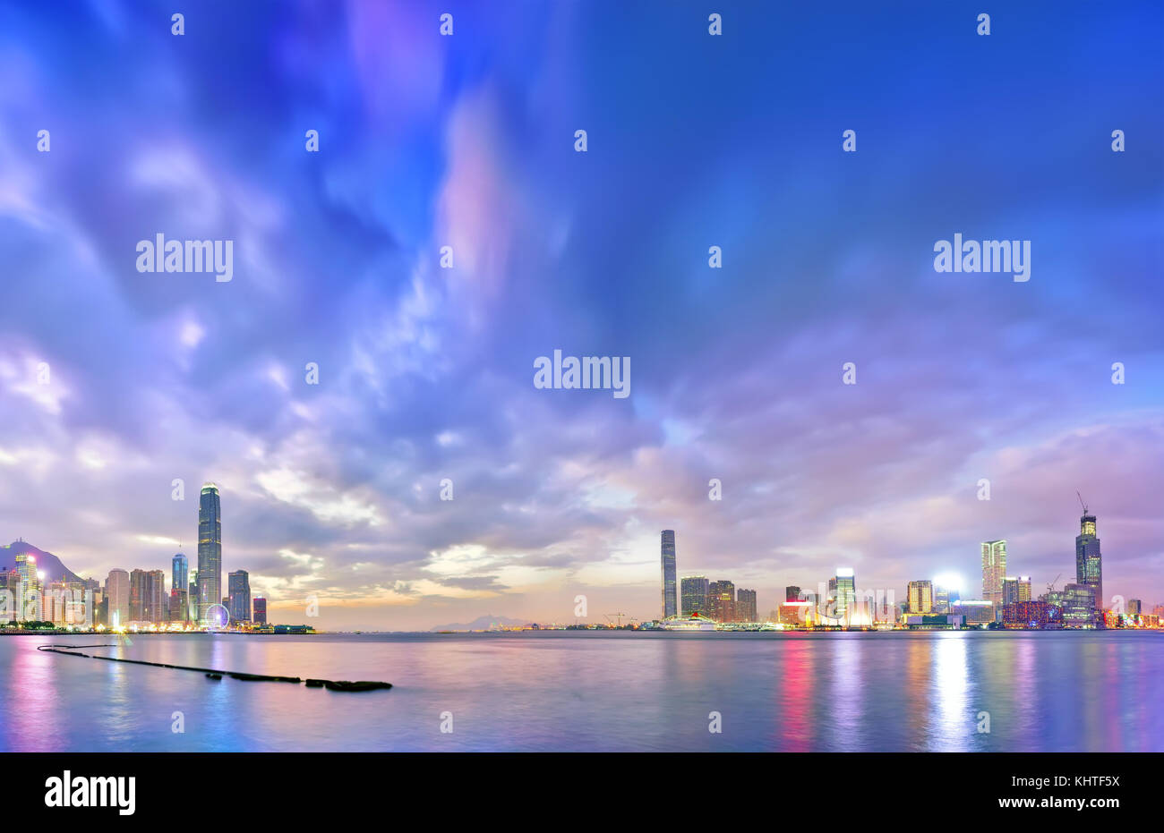 Victoria Harbor and Hong Kong skyline at dusk Stock Photo - Alamy