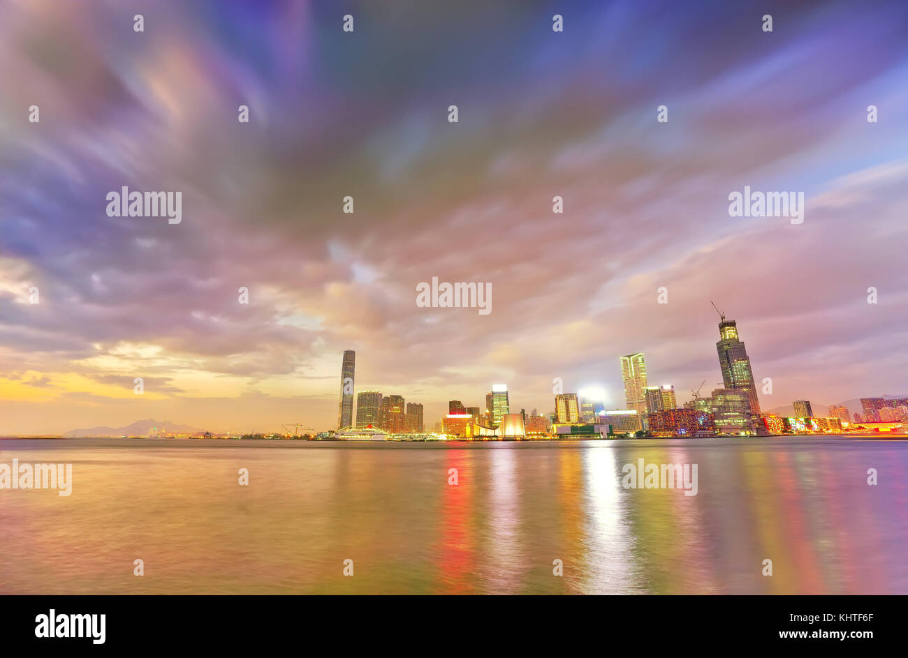 Victoria Harbor and Hong Kong skyline at sunset Stock Photo - Alamy