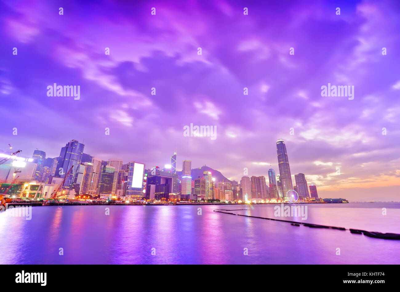 Victoria Harbor and Hong Kong skyline at dusk Stock Photo - Alamy