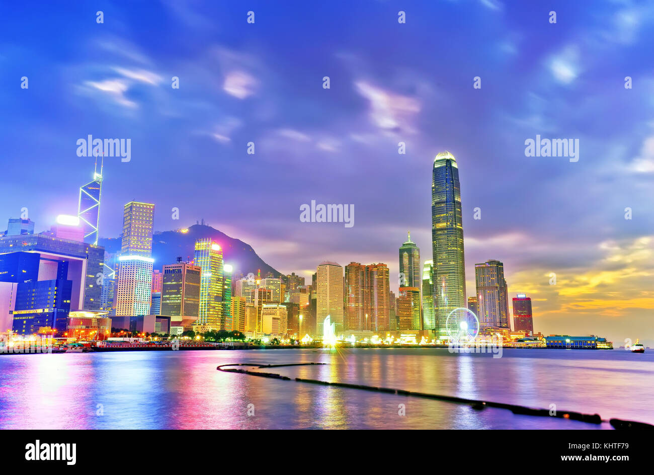 Victoria Harbor and Hong Kong skyline at sunset Stock Photo - Alamy