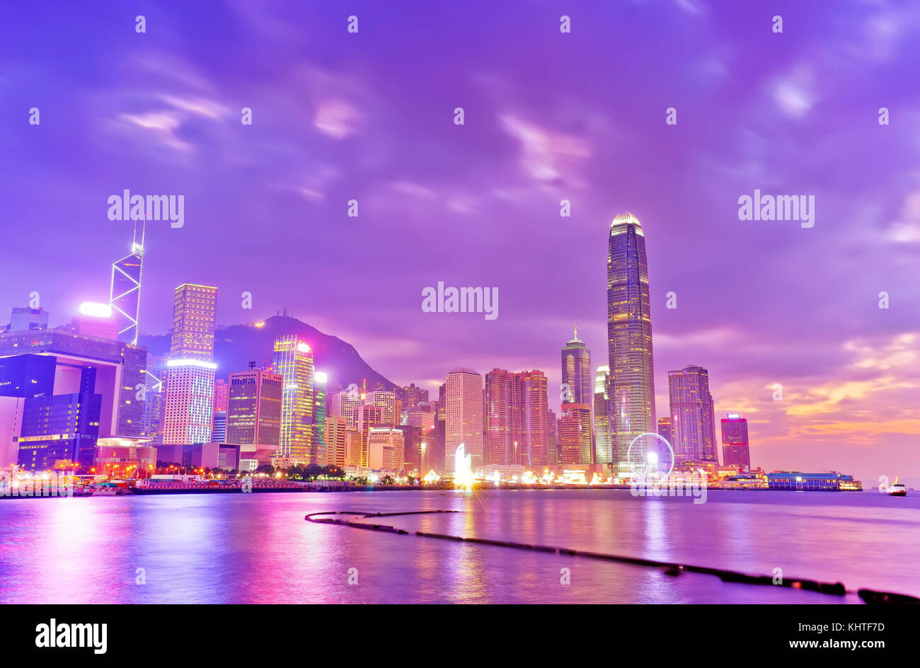 Victoria Harbor and Hong Kong skyline at dusk Stock Photo - Alamy