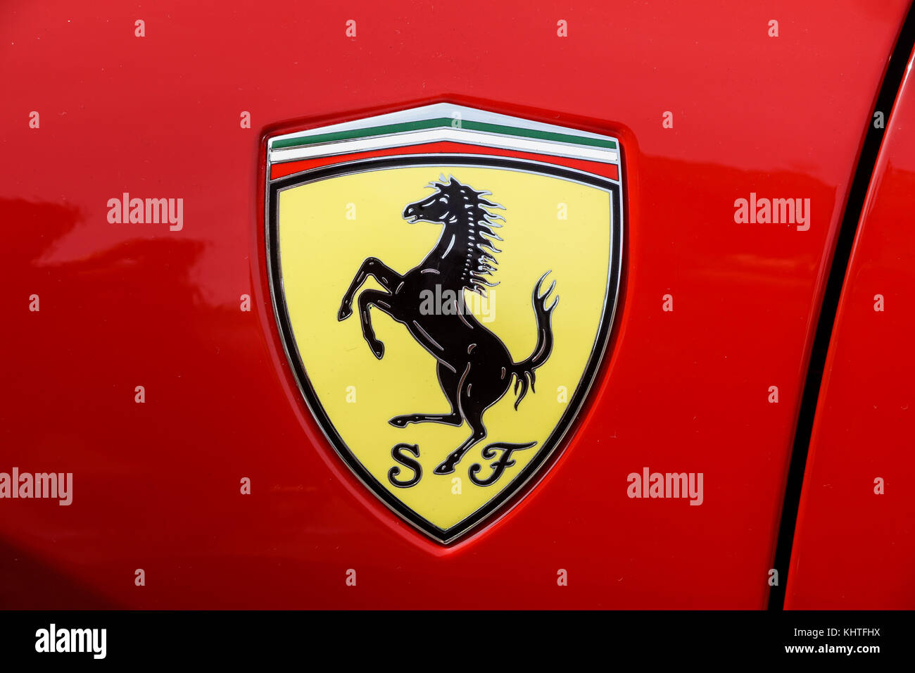 TURIN, ITALY - JUNE 10, 2017: Classic Ferrari logo on a red car body Stock Photo