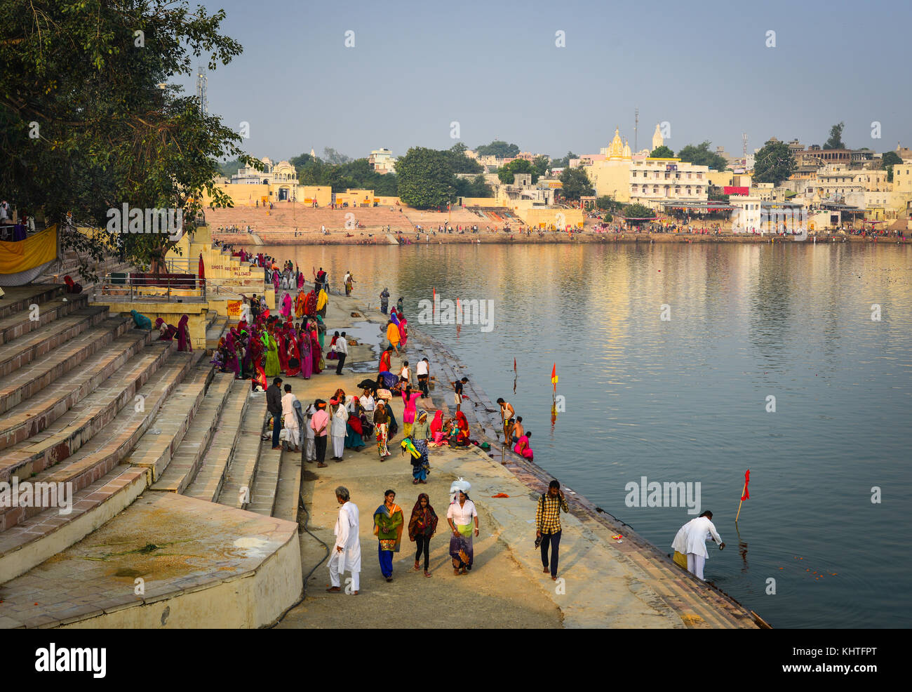 Pushkar, India - Nov 5, 2017. People praying on the holy lake in Pushkar, India. Pushkar is only 11km from Ajmer, separated from it by rugged Nag Paha Stock Photo