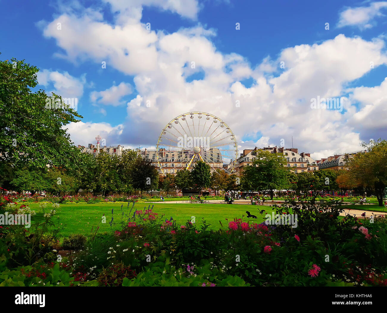 Landscape of Tuileries garden with Ferris wheel in a sunny summer day, Paris, France. Stock Photo