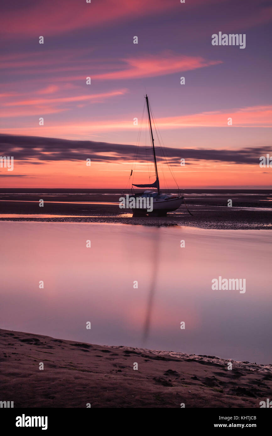Sunrise and smooth waters at Cleethorpes beach on the east coast of England Stock Photo Alamy