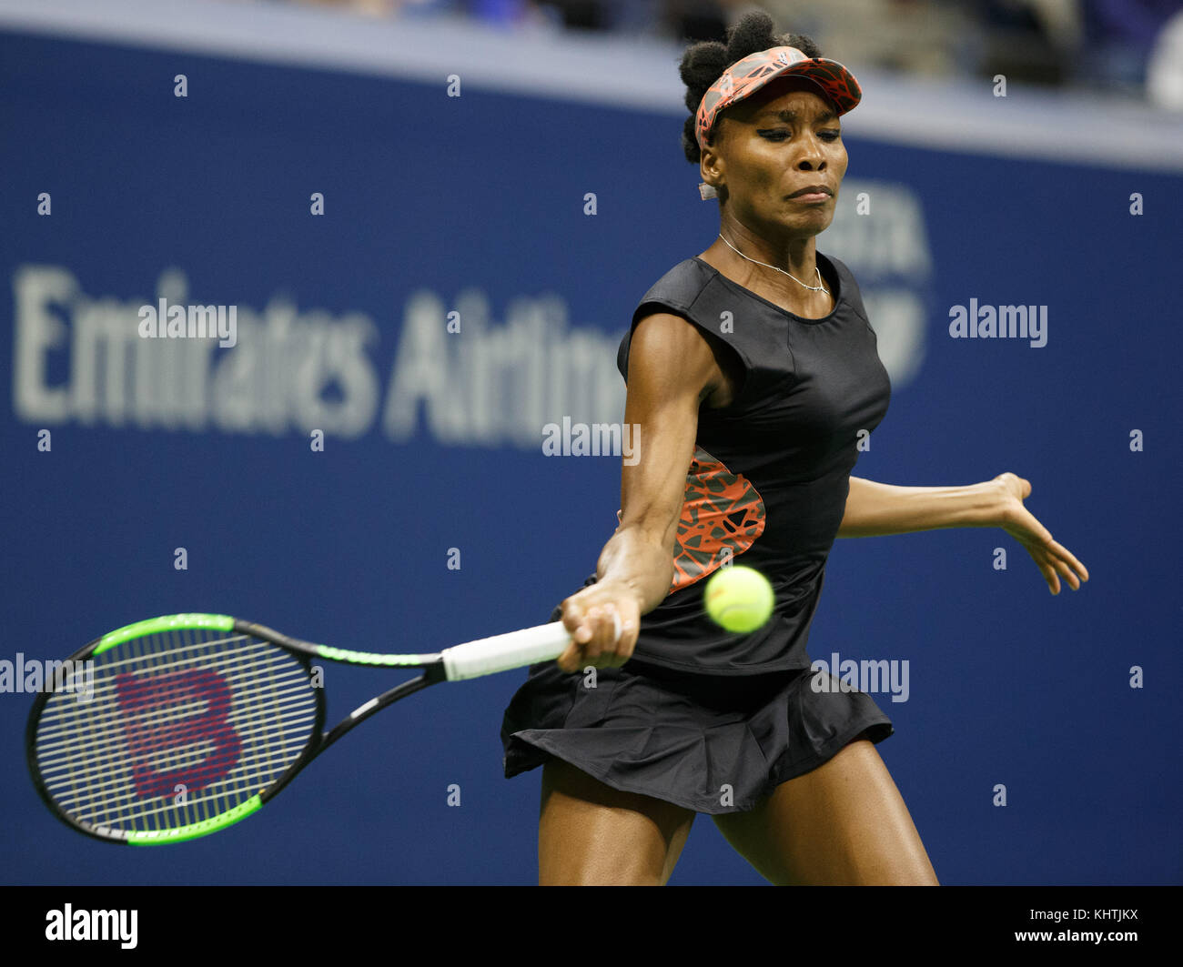 Professional sportsperson playing competition sport holding tennis