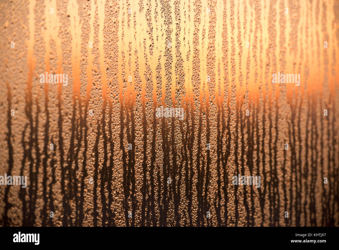 Abstract sunrise on a mirrored surface covered in dew, Nottingham City  England UK Stock Photo