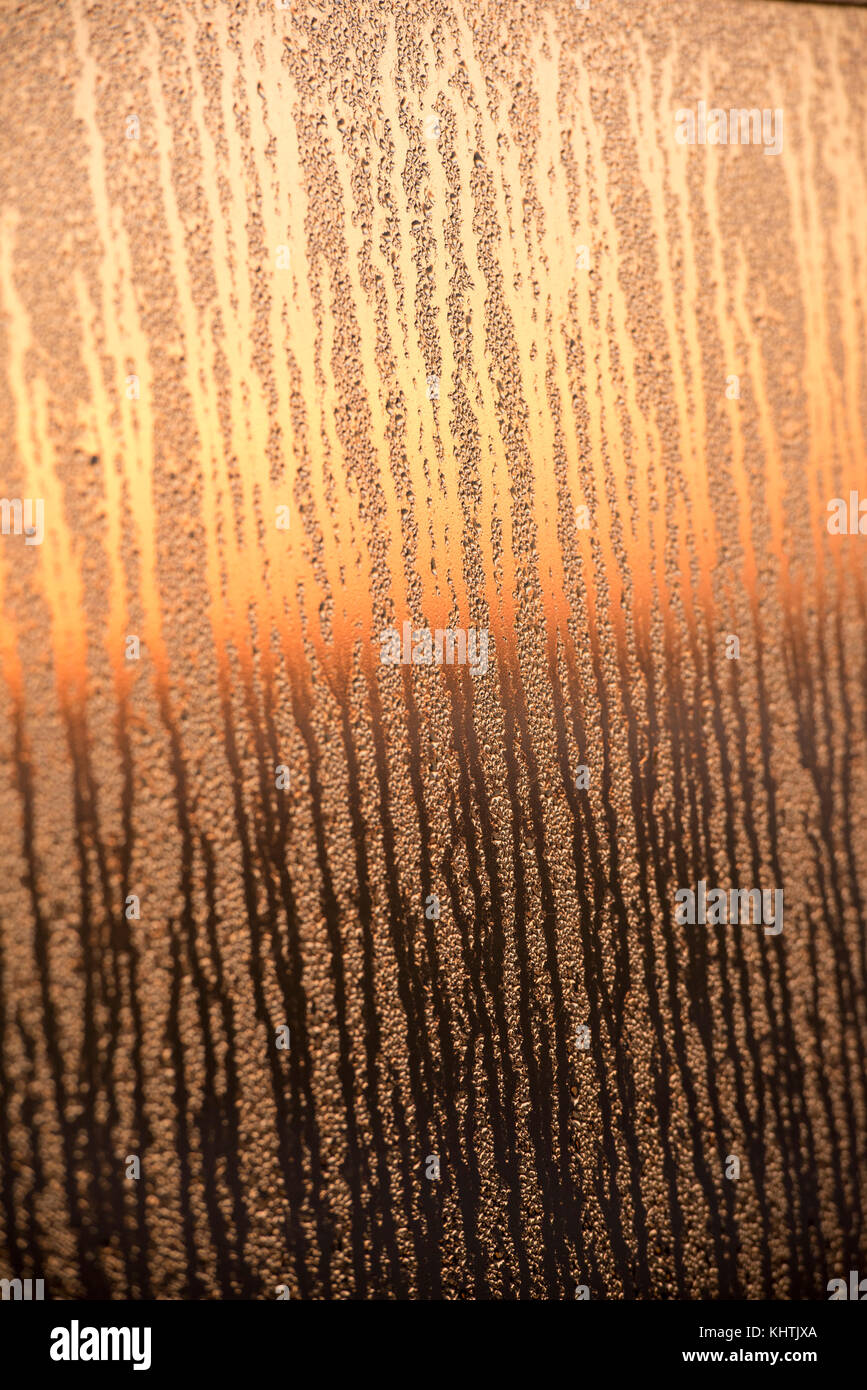 Abstract sunrise on a mirrored surface covered in dew, Nottingham City  England UK Stock Photo