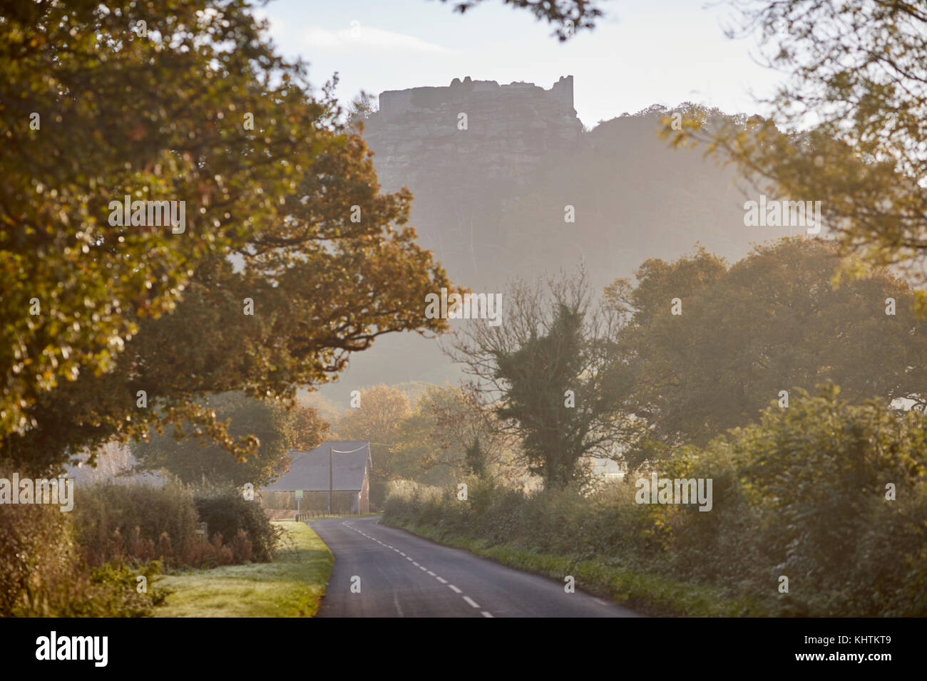 Autumn in Cheshire, former Royal medieval Beeston Castle perched on a rocky sandstone crag seen through he morning mist and fog. Stock Photo