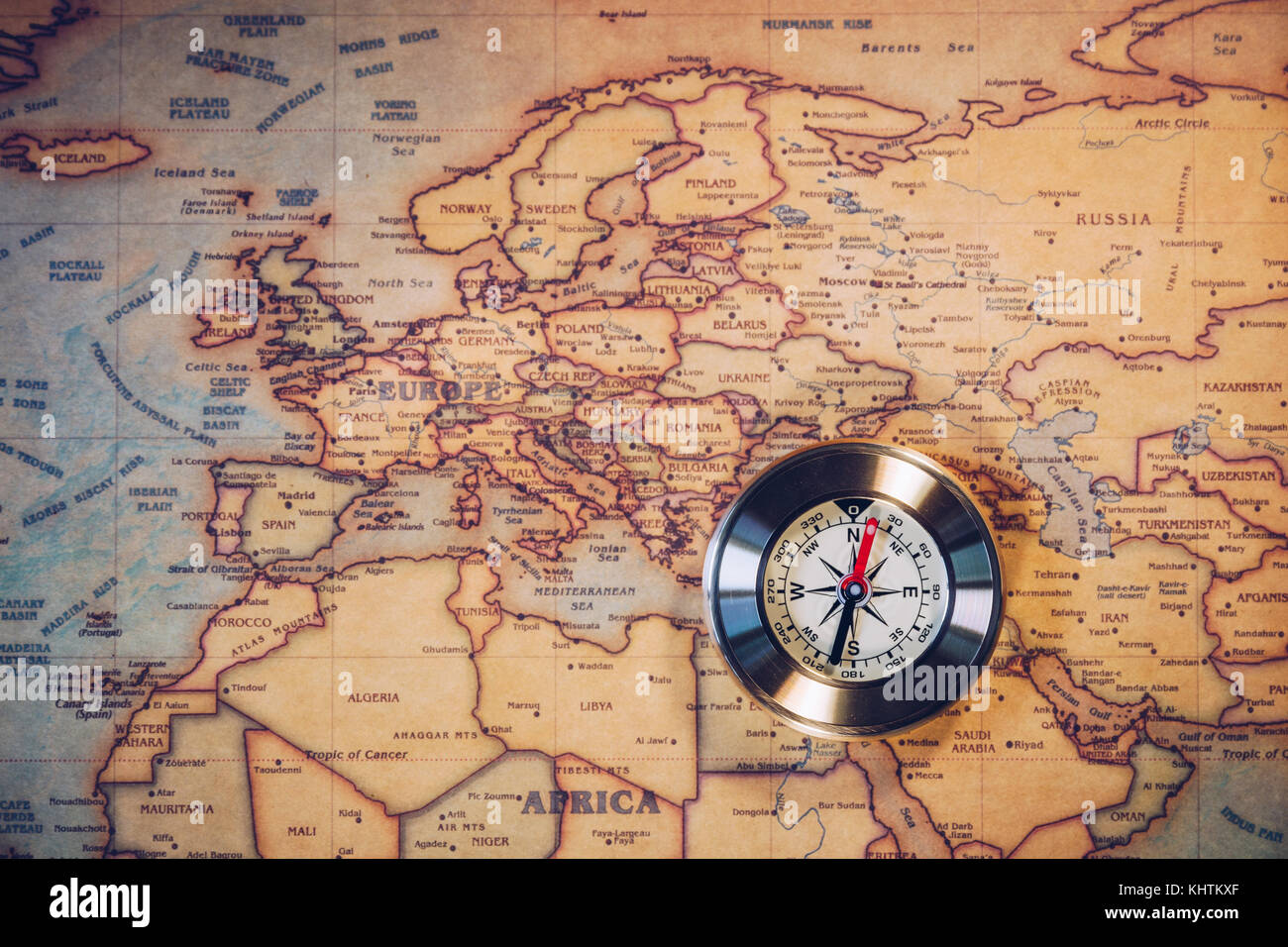 Old compass on vintage map. Adventure stories background. Retro style. The map used for background is in Public domain. Map source: Library of Congres Stock Photo