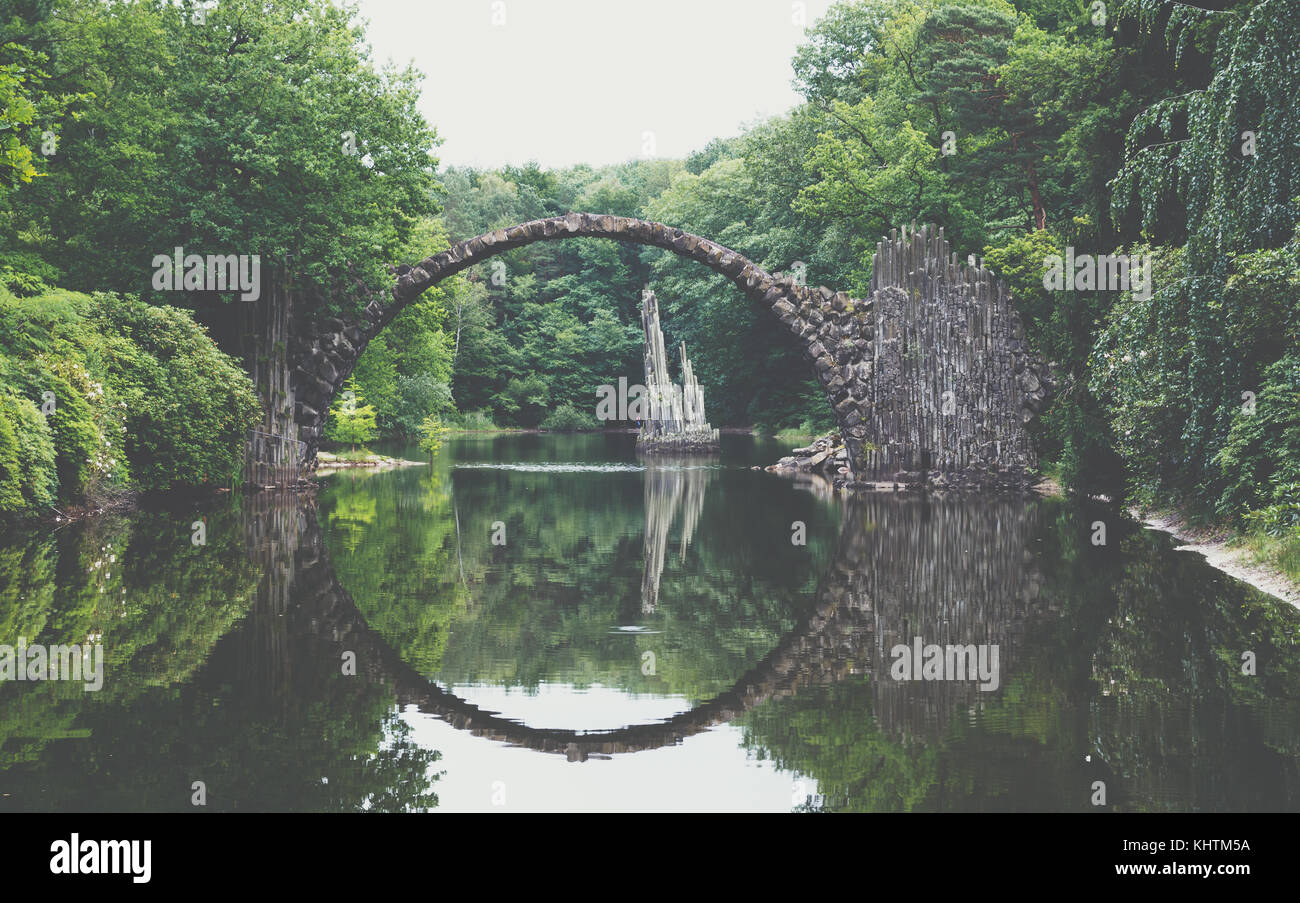 Rakotz bridge (Rakotzbrucke) also known as Devil's Bridge in Kromlau, Germany. Reflection of the bridge in the water create a full circle. Stock Photo