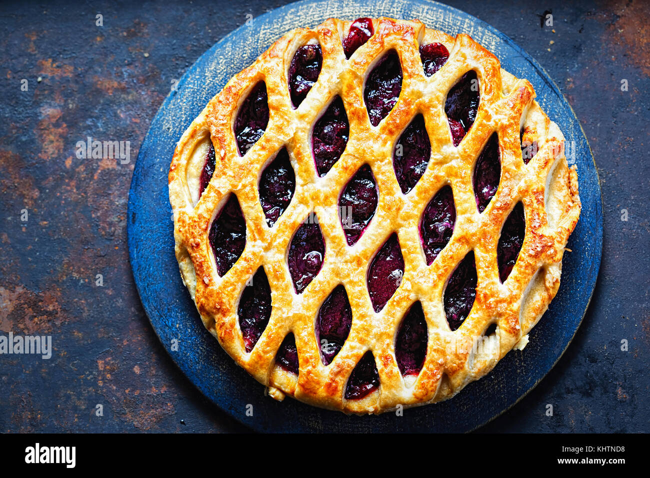 Lattice autumn fruit pie, with blackcurrant, blackberry, cherry compote