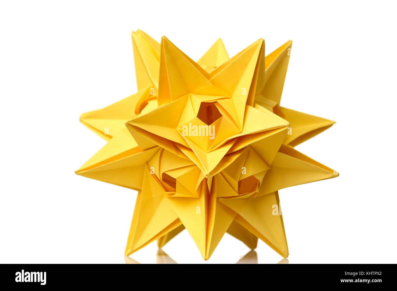 Yellow star origami figurine Stock Photo
