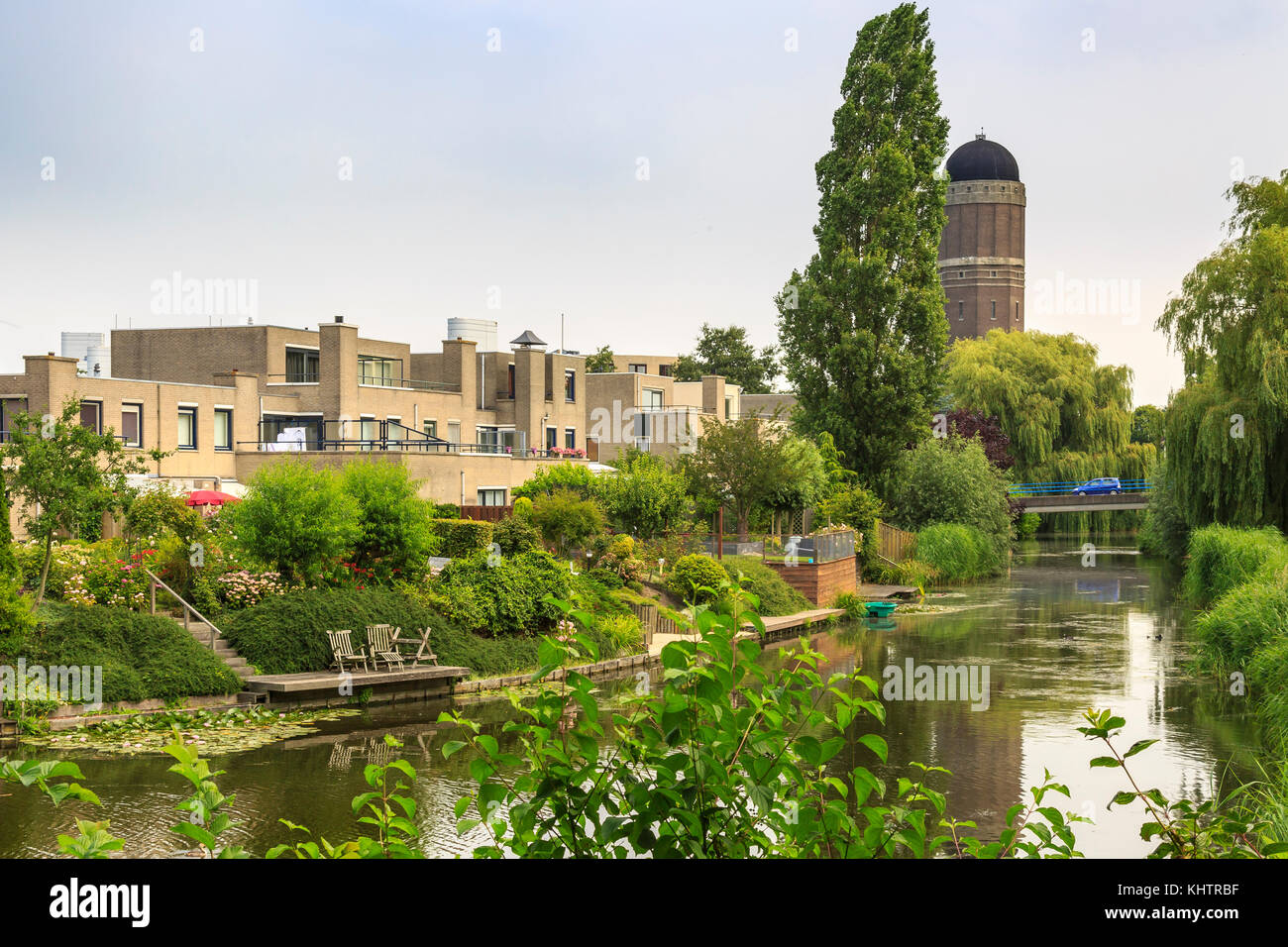 Residential houses on the waterside with a water tower on the