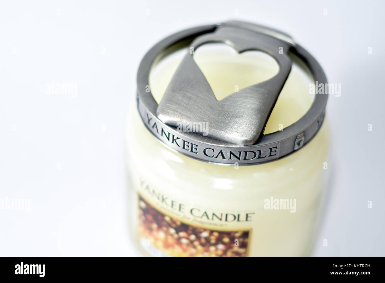 A Yankee candle Christmas edition in a glass jar with heart shaped brushed lid Stock Photo